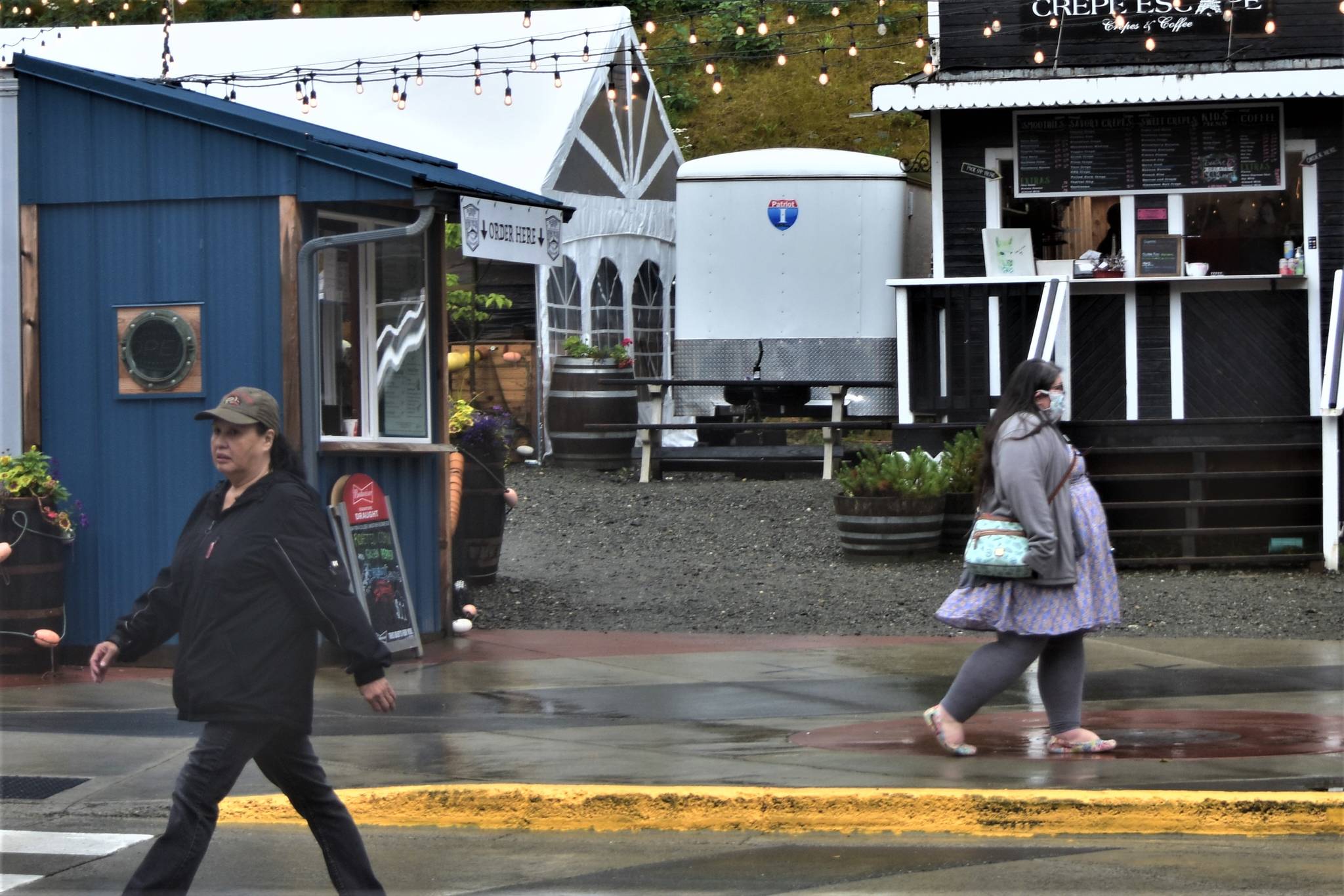 Pedestrians in downtown Juneau on Monday, July 20, 2020. The City and Borough of Juneau voted a mandate for cloth face-covering in public spaces at a special meeting Monday night. (Peter Segall | Juneau Empire)