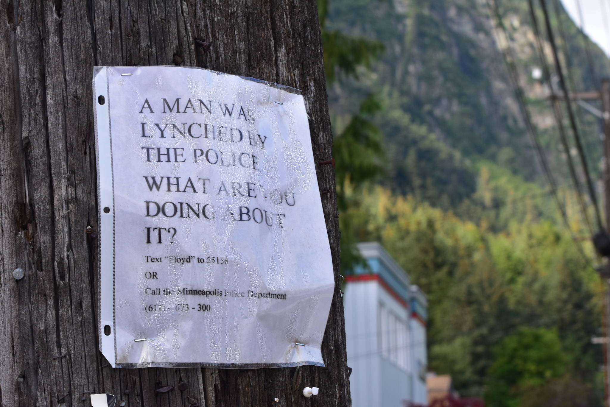 A flyer posted to a telephone pole in downtown Juneau on Thursday, July 23, 2020, with a call to action in response to the death of George Floyd, a Minneapolis man who died in police custody, after an officer pressed his knee into Floyd’s neck for nearly eight minutes. The City and Borough of Juneau has been trying to address community concerns about racism and is proposing a Racism Review Committee to review city ordinances.