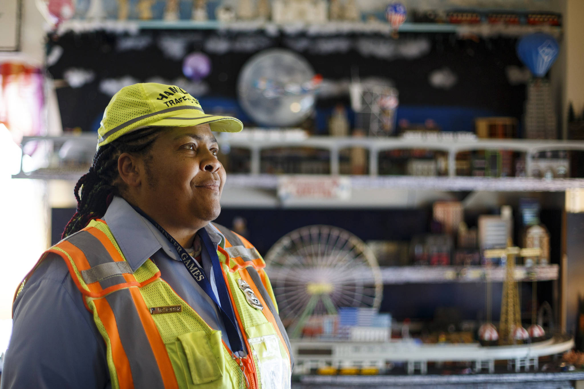 Patrice Jetter, a furloughed school crossing guard, poses for a photograph, Thursday, July 23, 2020, in Hamilton, N.J. Jetter, who has cerebral palsy and partial hearing loss, wanted to work with kids when graduating from high school. (AP Photo/Matt Slocum)