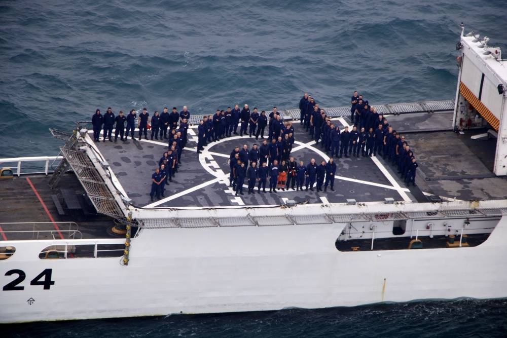 Members from Coast Guard Cutter Douglas Munro stand in formation on the back of the cutter, July 24, 2020. The cutter’s hull day, July 24, correlates with its hull number, 724. (Courtesy photo / U.S. Coast Guard)