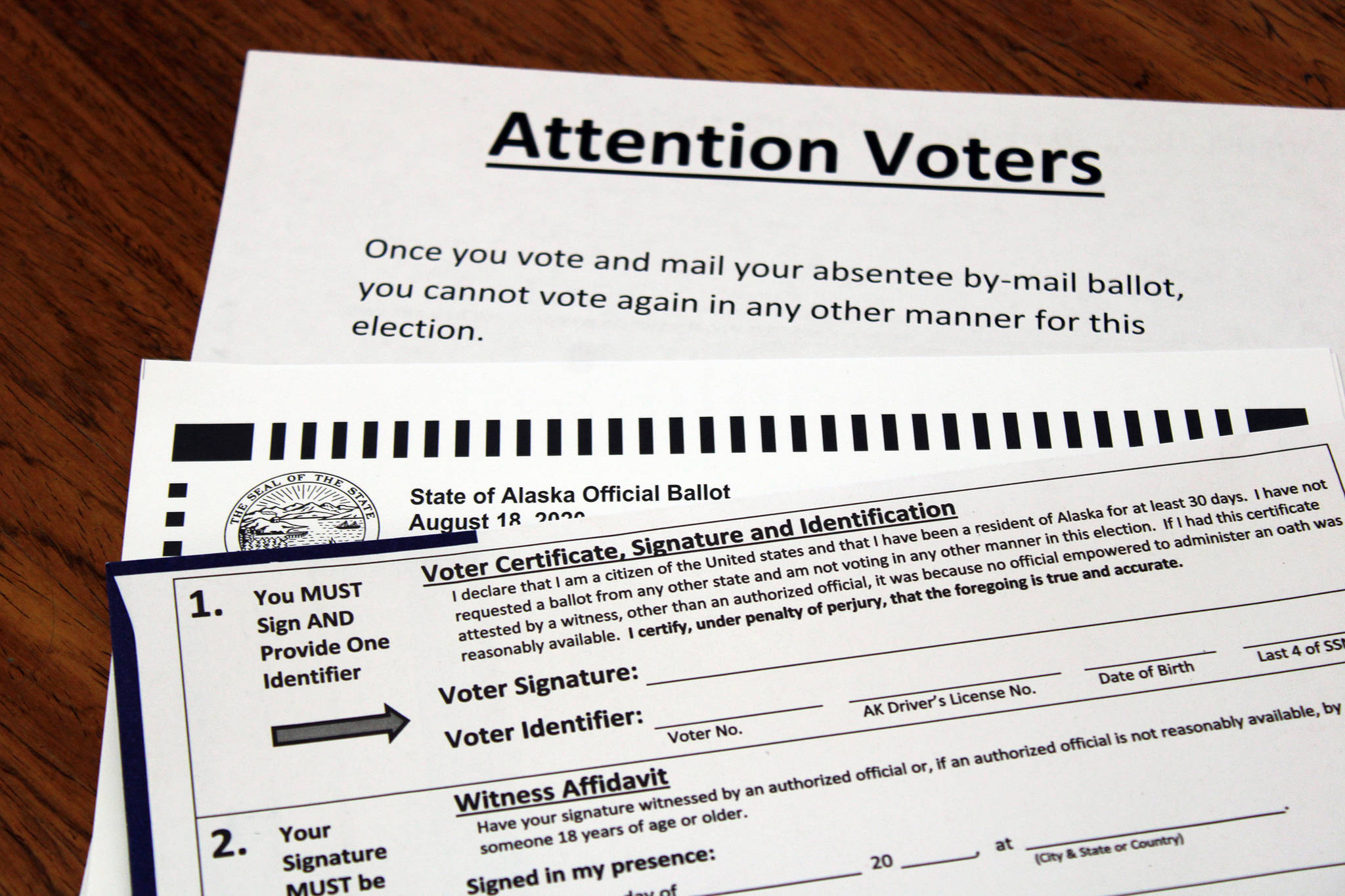 This photo shows absentee ballot paperwork sent to an Alaskan voter in July 2020. (Ben Hohenstatt | Juneau Empire)