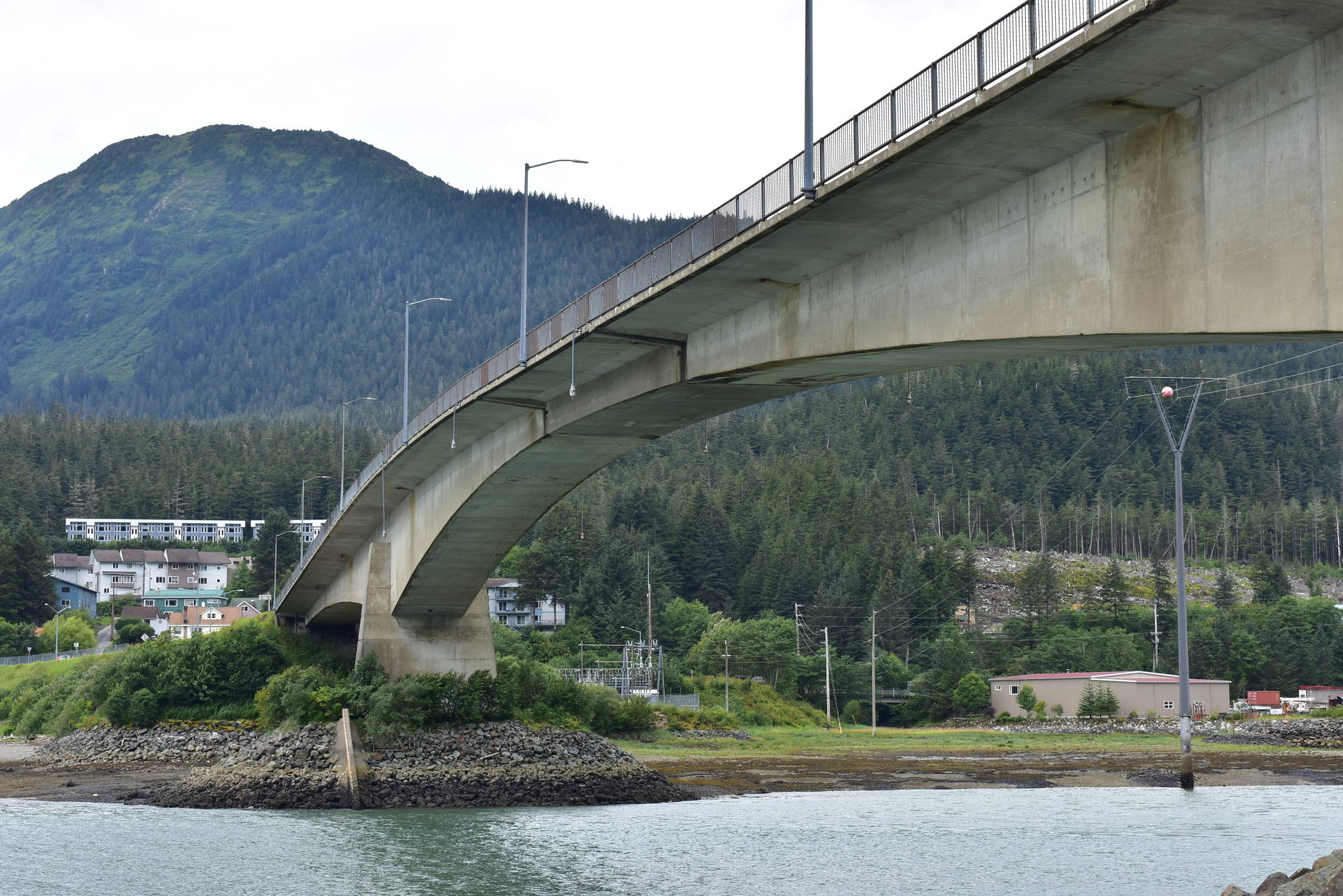 A crane being ferried on a barge briefly struck the underside of the Douglas Bridge Wednesday evening. The Alaska Department of Transportation and Public Facilities and the City and Borough of Juneau have said there appears to be no damage, but further investigations will be conducted. (Peter Segall / Juneau Empire)