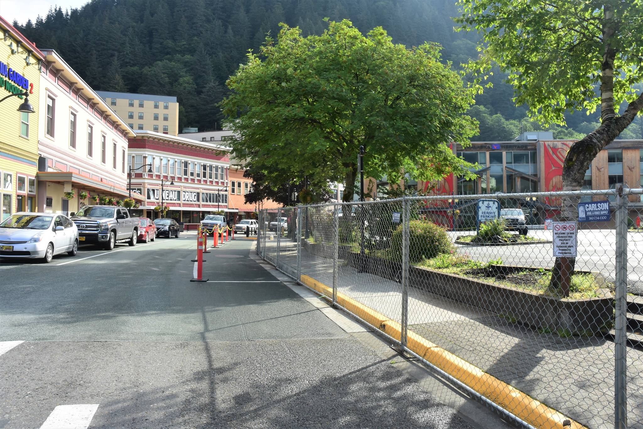 Peter Segall / Juneau Empire Fencing goes up around the Sealaska building parking lot in downtown Juneau on Thursday. By this time next year, SHI hopes to have its arts campus open and running, if not yet fully finished.