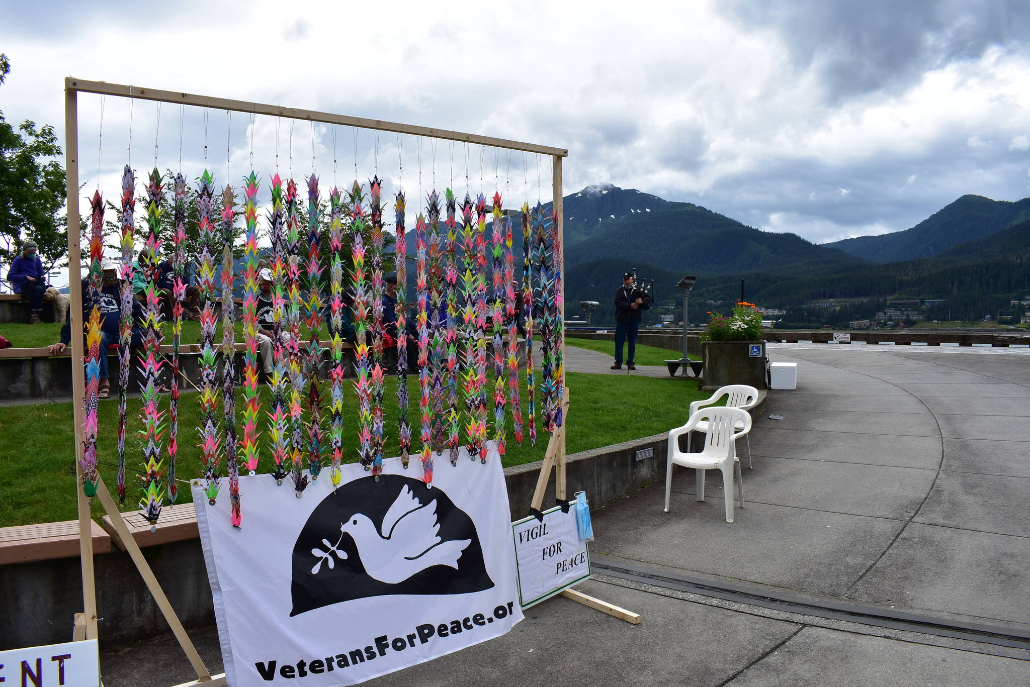 A man plays bagpipes at a silent vigil commemorating the 75th anniversary of the atomic bombings of Hiroshima and Nagasaki at Marine Park on Thrusday, Aug. 6, 2020. (Peter Segall / Juneau Empire)