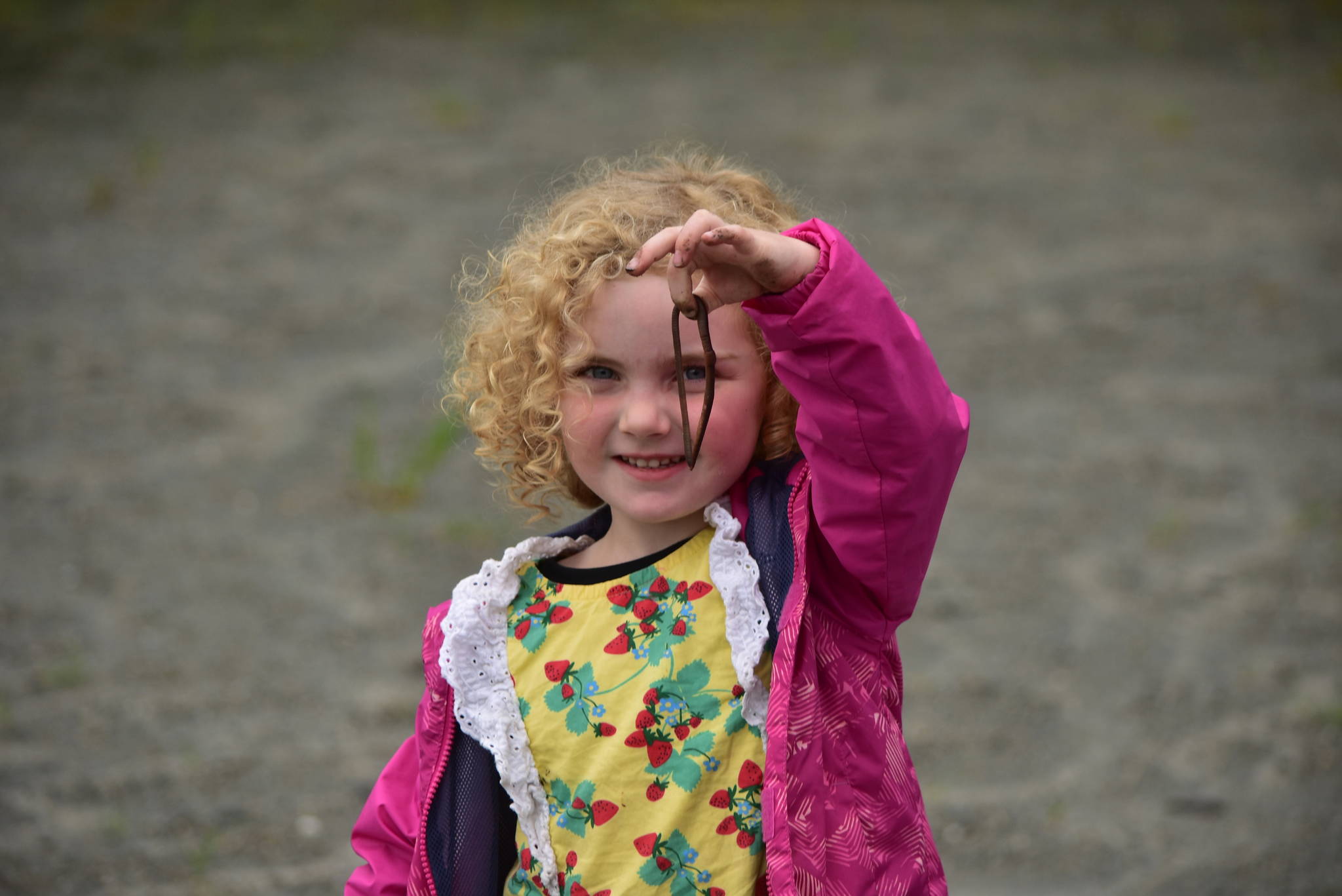 Juneau Montessori School student Abby Auerswald was eager to share a worm she found on Tuesday, Aug. 11, 2020. She doesn’t usually hold big worms, she said, but noted she was holding this particular worm in spite of its large size. (Peter Segall / Juneau Empire)