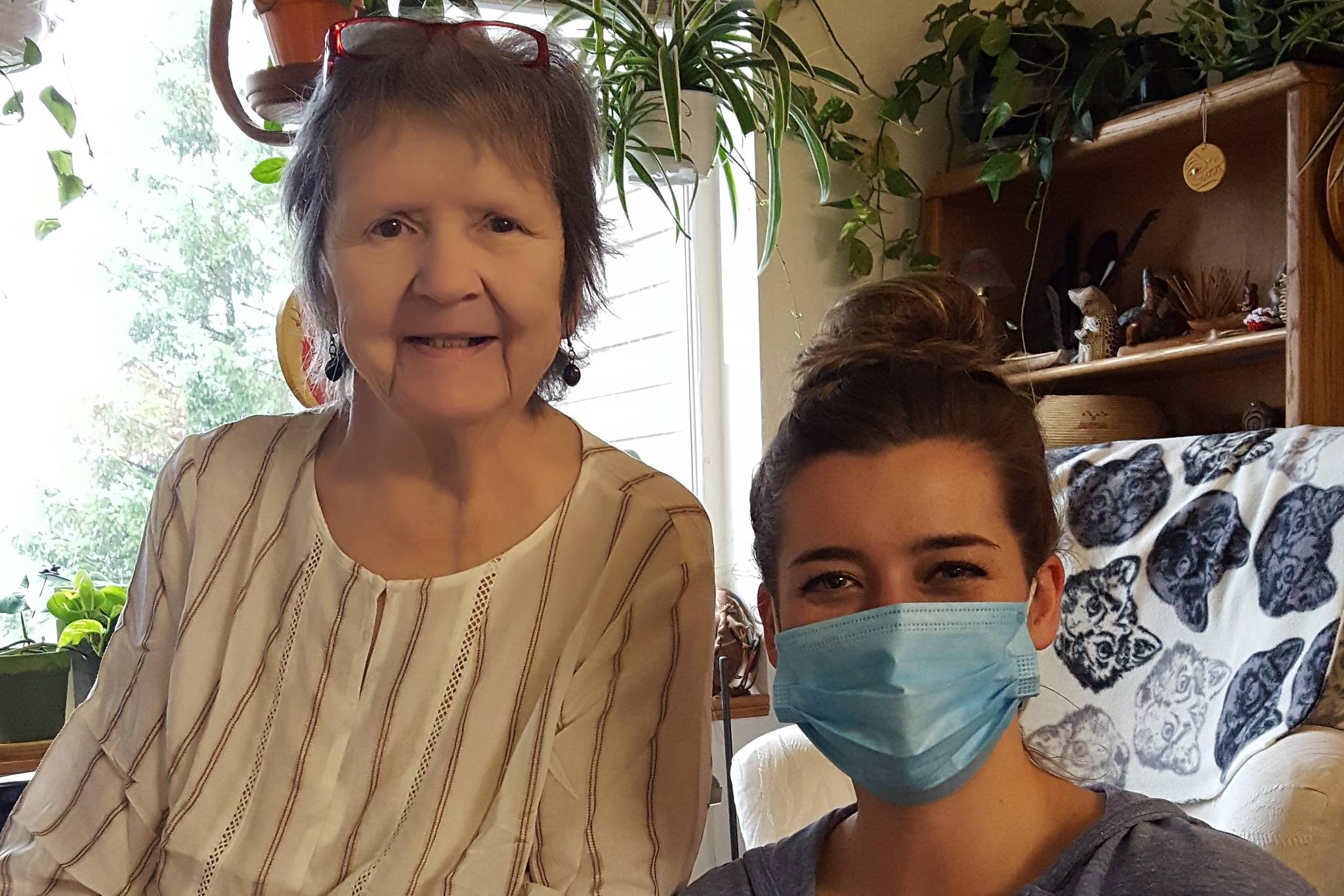Carol OGara, left, sits with volunteer Madeline Kauffman during one of their weekly visits. Volunteers provide a number of services of seniors, including providing them company. (Courtesy photo / Catholic Community Services)