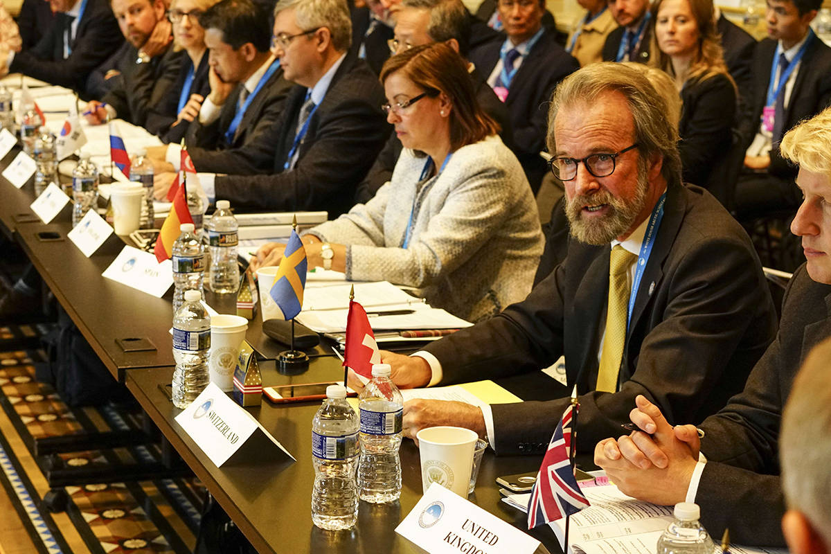 Konrad Steffen, wears glasses and a yellow tie, at the White House in 2016, where he represented Switzerland at the first Arctic Ministerial Conference. (Courtesy Photo / Swiss Federal Institute for Forest, Snow and Landscape)