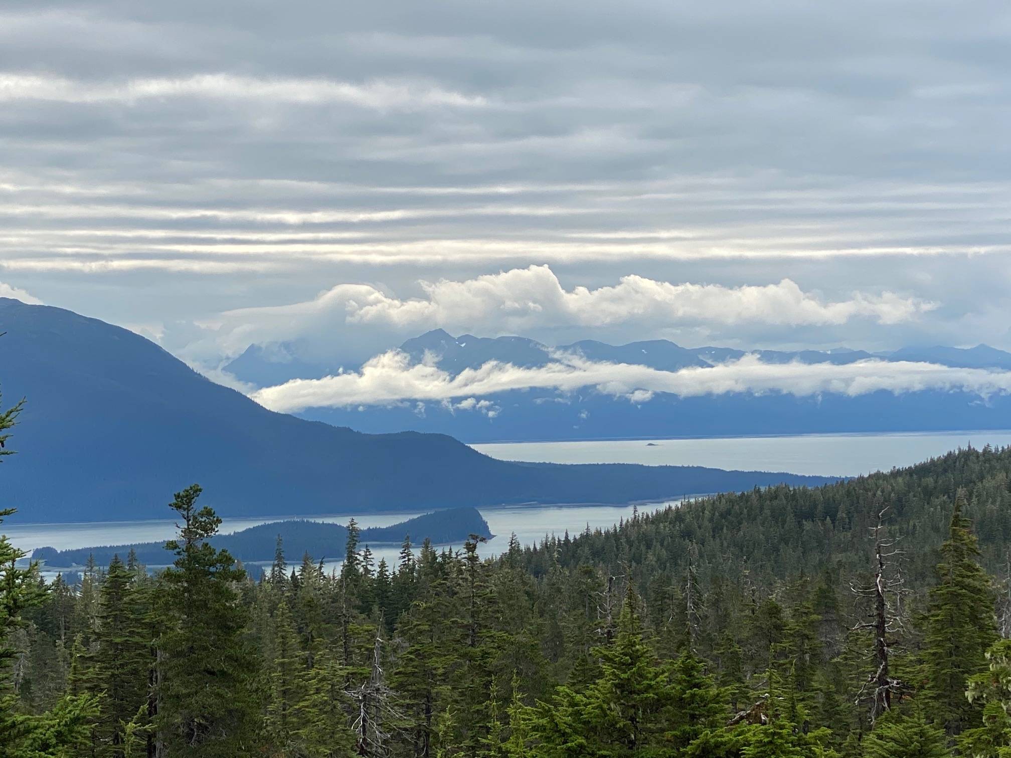 A view of the silhouette of North Douglas and heavy cloud cover over the Chilkats and Auke Bay on Aug. 19, 2020. (Courtesy Photo / Denise Carroll)