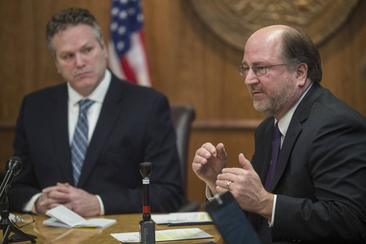 In this file photo, Gov. Mike Dunleavy, left, listens as Attorney General Kevin Clarkson speak during a news conference at the Capitol on Wednesday, Jan. 30, 2019. Clarkson’s resignation was announced following revelations of inappropriate text messages with a state employee. (Michael Penn / Juneau Empire File)