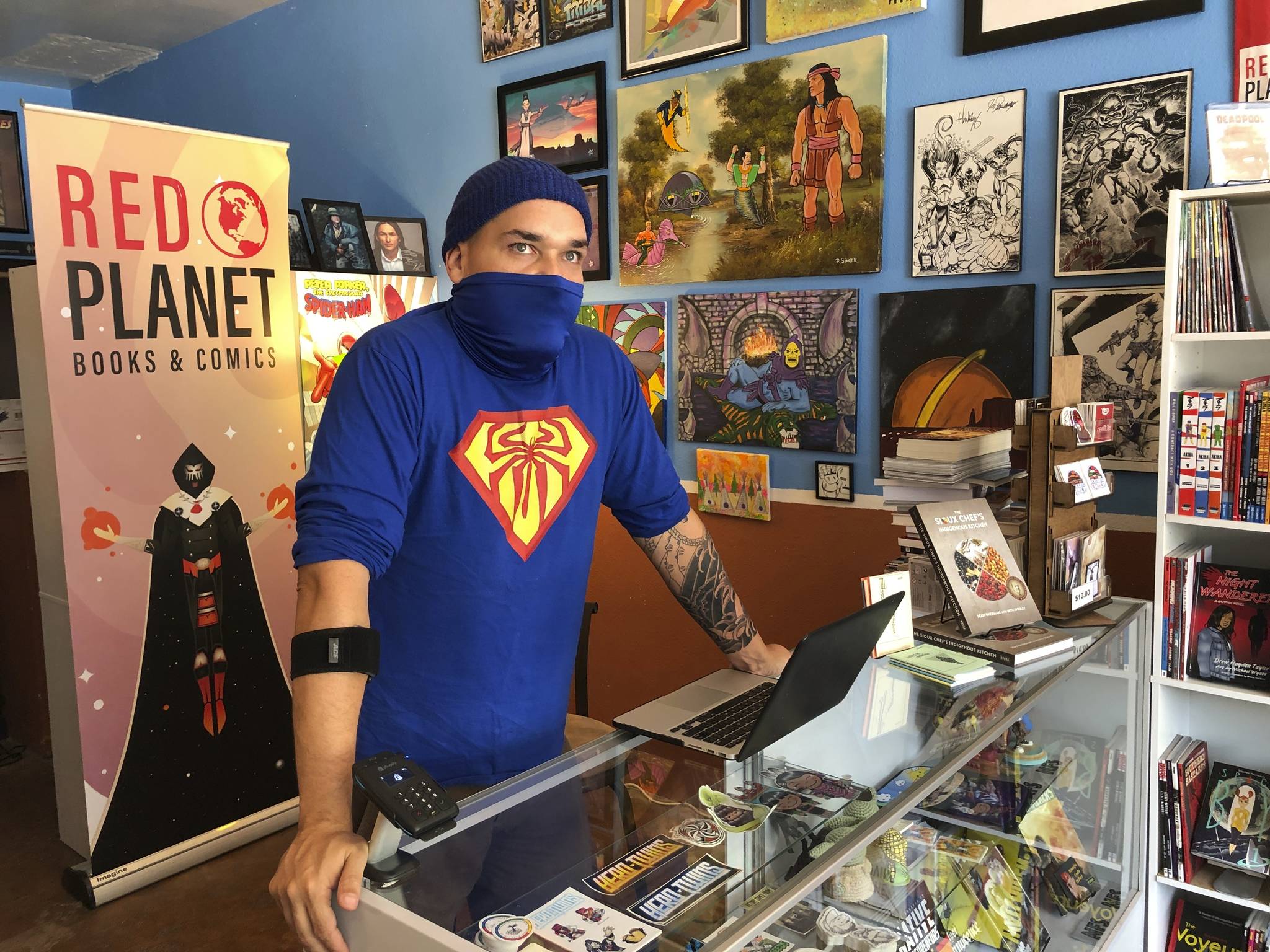 This Aug. 19, 2020, image shows Aaron Cuffee of Red Planet Books & Comics in Albuquerque, N.M., as he discusses the potential that could come from Marvel Comics’ effort to assemble a gallery of Native artists and scribes for “Marvel Voices: Indigenous Voices #1.” The anthology will revisit some of Marvel’s Native characters. (AP Photo / Susan Montoya Bryan)