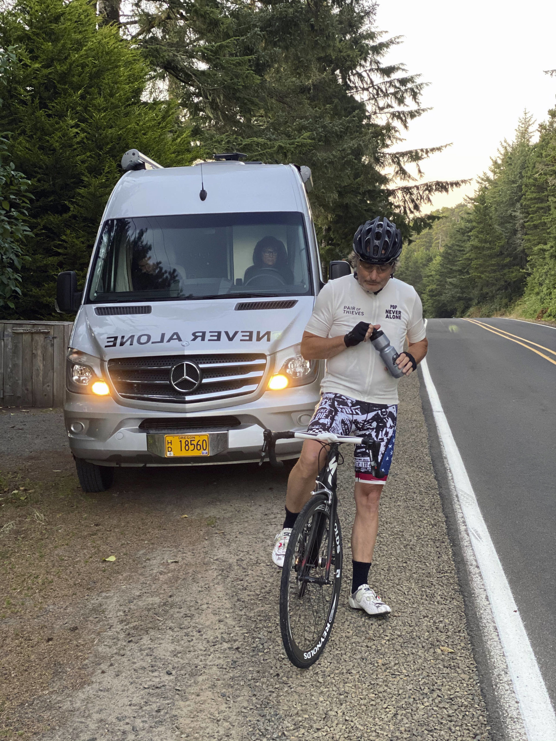 Alan Stuart/Pair of Thieves                                 This photo shows Doug Peterson stopped alongside the road with his wife, Lori, driving the support van as he cycles from the Canadian border to the Mexican border, last week in Pacific City, Ore. It was January 2015 that 17-year-old Page Peterson, the carefree Oregon boy who pitched on the baseball field and tore down the slopes on his snowboard, died by suicide. He was among more than 2,000 teenagers his age that would commit suicide in that year alone, a number that is both staggering and heartbreaking. Now, his father Doug Peterson is riding his bike from the Canadian border to the Mexican border during the month of September, raising money with the support of apparel company Pair of Thieves and awareness for National Suicide Prevention Month.