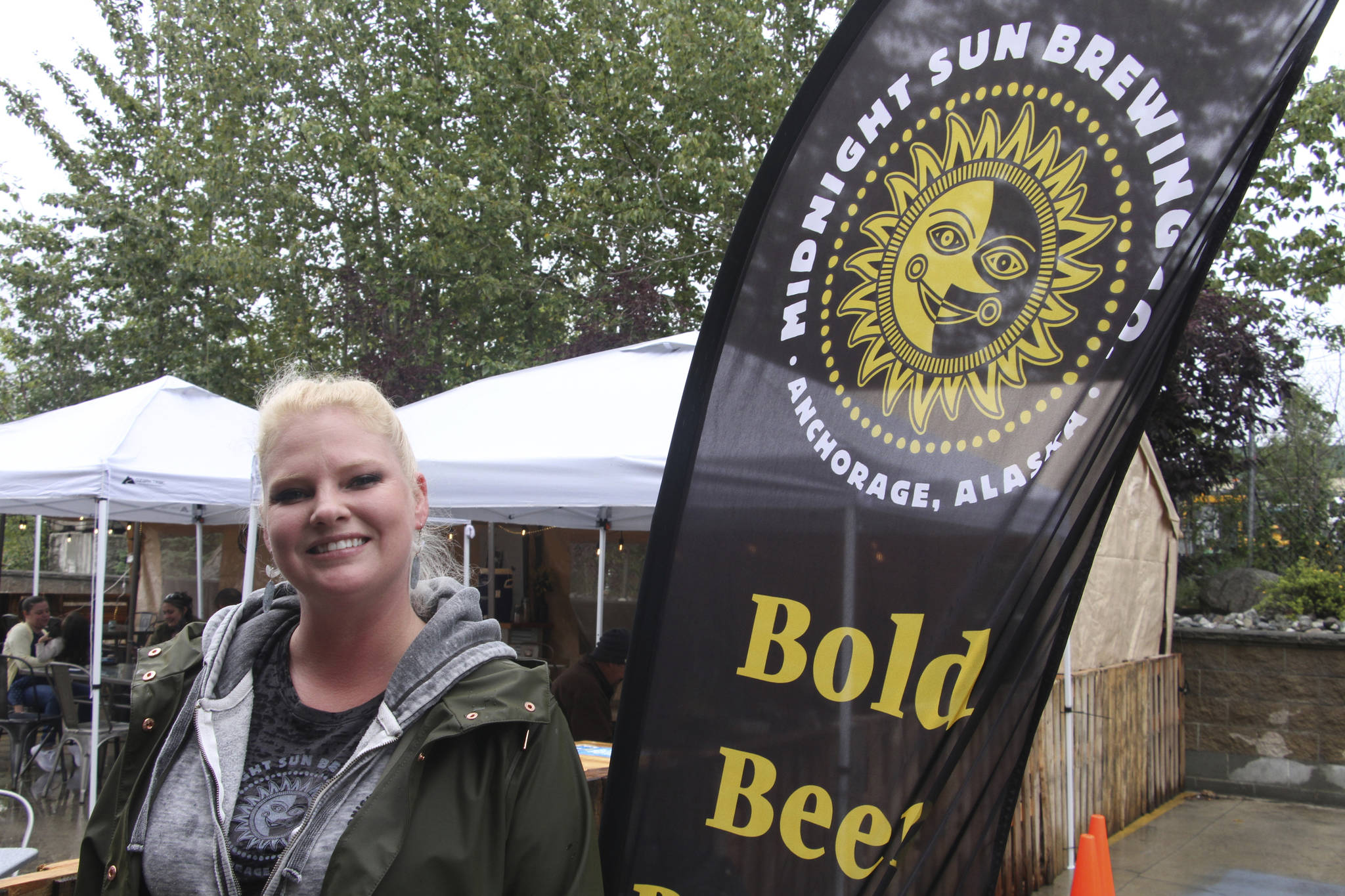 Angelina Backus poses for a photo at the Midnight Sun Brewing Co., Monday, Aug. 24, 2020, in Anchorage, Alaska. Backus, who is a lead server at the brewery, received a $500 tip from Jack Little, and said it helped her pay bills that were piling up during the coronavirus pandemic. (AP Photo / Mark Thiessen)