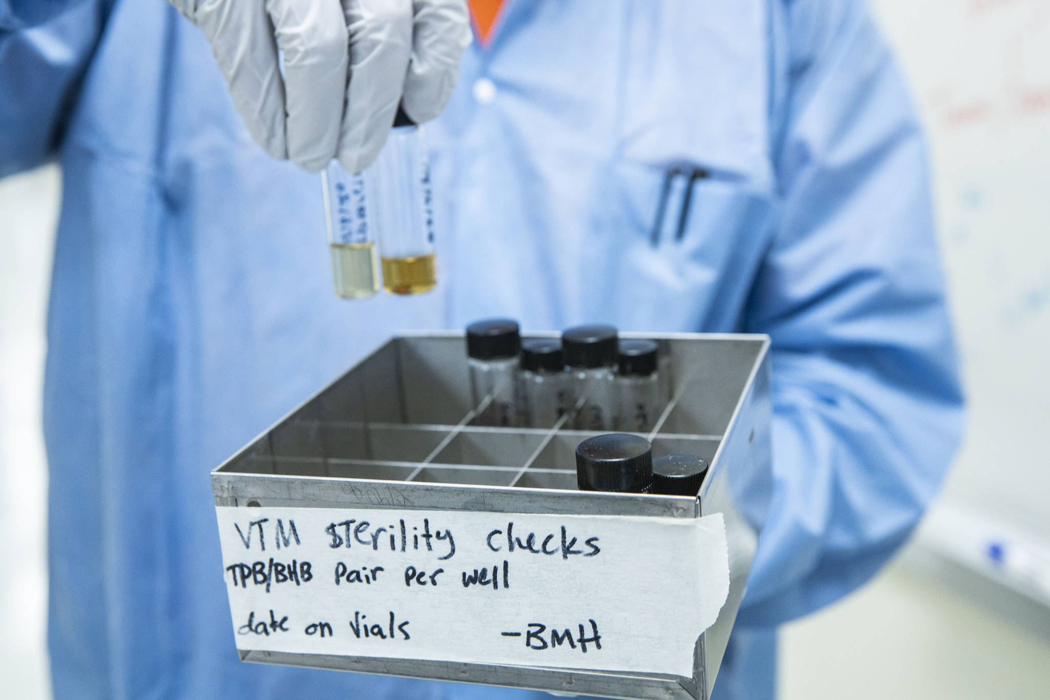 Alaska State Virology Laboratory technician Ben Hedges holds vials of viral transport medium that are being tested for sterility. The lab manufactures the transport medium on site for use in COVID-19 testing in Alaska. (Courtesy Photo / JR Ancheta, University of Alaska Fairbanks)