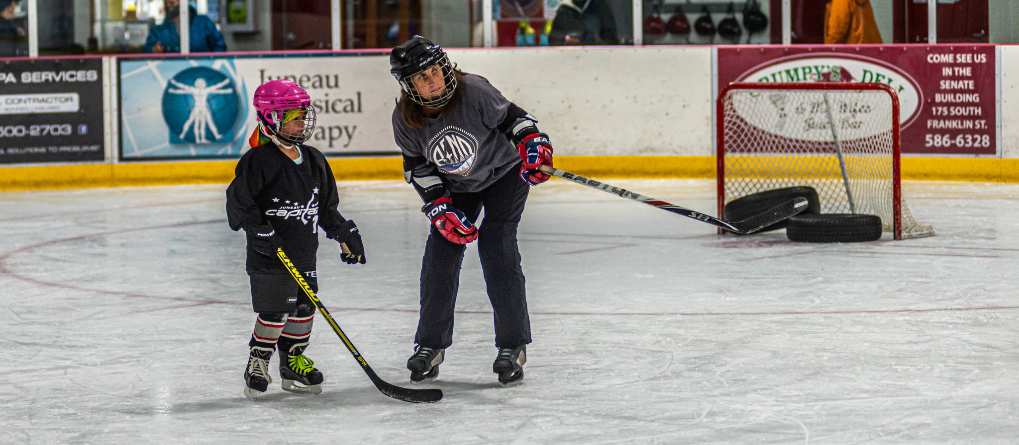 Youth hockey coach Heather Brandon works a young girl participating in a recent pre-season workout at Treadwell Ice Arena. (Courtesy Photo / Steve Quinn)