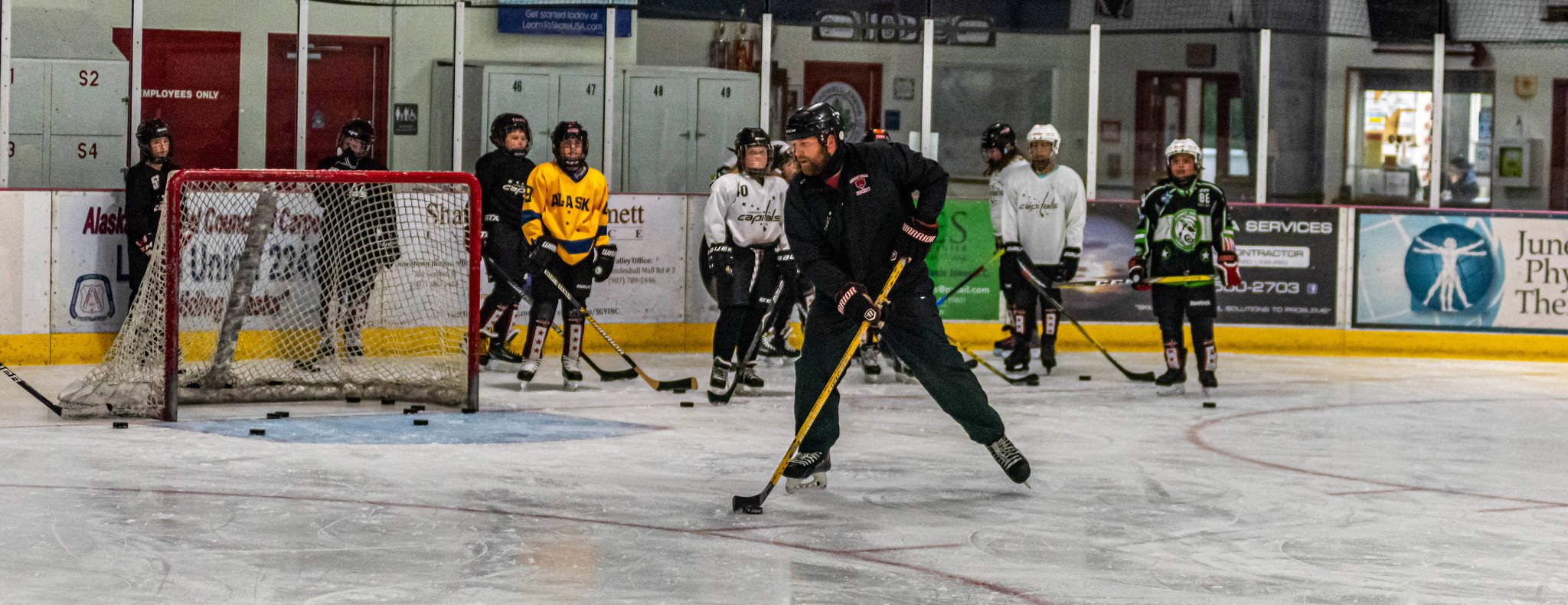 Courtesy Photos / Steve Quinn Matt Boline demonstrates a drill during a recent workout with players in the 12-and-under group workout at Treadwell Ice Arena.