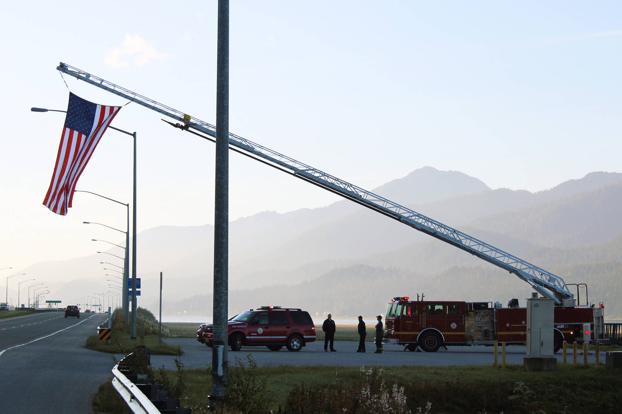 Capital City Fire/Rescue flies an American flag near the Mendenhall Wetlands State Game Refuge on the morning of Friday, Sept. 11, 2020. Friday was the 19th anniversary of the 9/11 terror attacks. (Ben Hohenstatt / Juneau Empire)