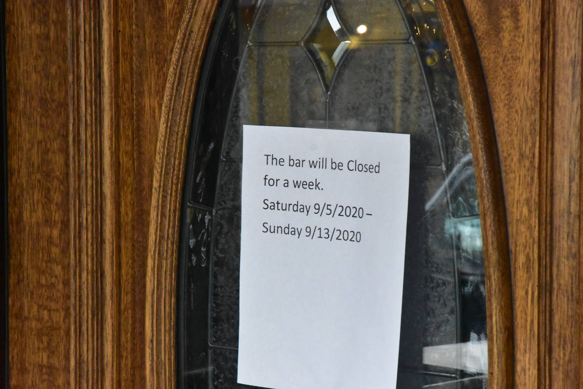 A sign on the doors of the Alaskan Hotel and Bar in downtown Juneau letting customers know of a temporary closure. (Peter Segall / Juneau Empire)