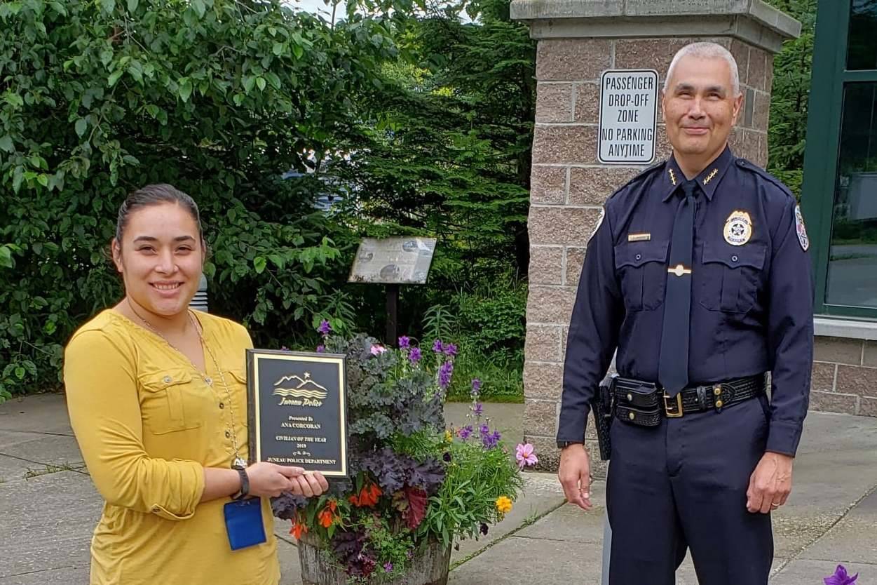 Ana Corcoran, left, receives a plaque from Juneau Police Department Chief Ed Mercer naming her his choice for JPD’s Civilian of the Year, Sept. 18, 2020. (Courtesy Photo / Juneau Police Department)