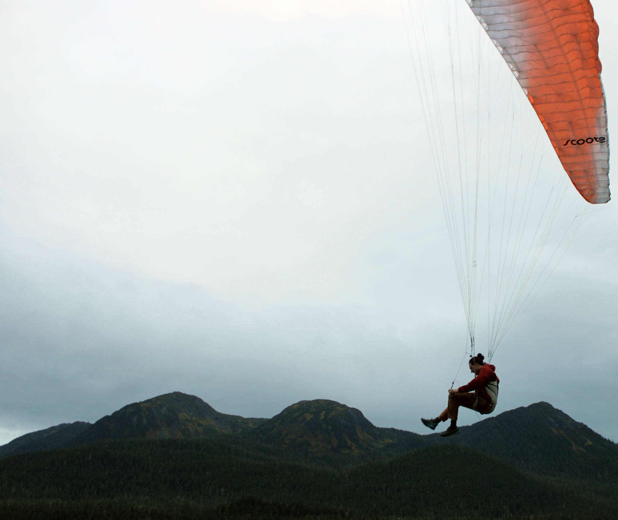 Greg Kopache said he often paraglides near Mount Roberts, but on Tuesday, Sept. 22, 2020, he was one half of a pair of gliders floating along Channel Drive. (Ben Hohenstatt / Juneau Empire)