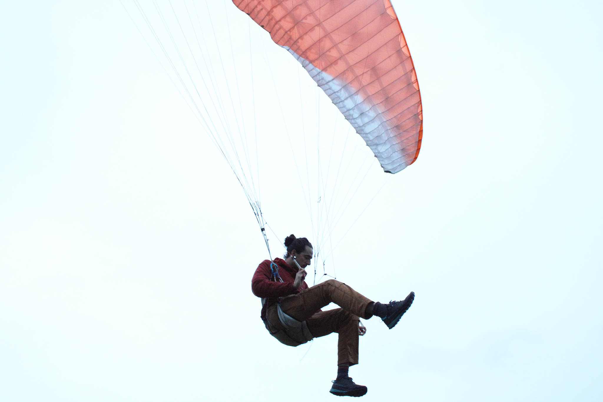 Greg Kopache glides through the air for a moment after taking along Channel Drive the Evening of Sept. 22, 2020. Ben Hohenstatt / Juneau Empire)