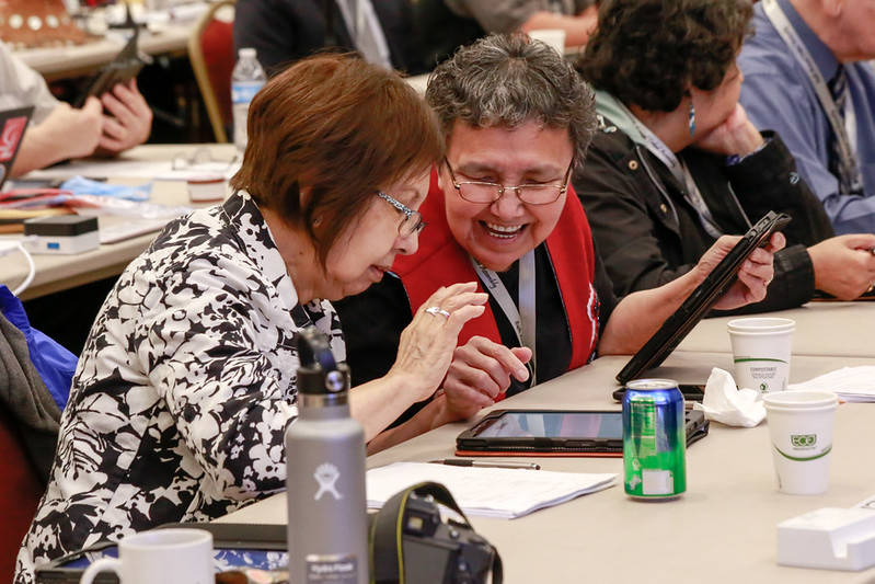 Juneau delegates Arlene and Ella Bennett use tablets at the 2019 Tribal Assembly in Juneau. Tablets were introduced last April to help with voting, and because this year’s event is entirely virtual, Tlingit and Haida sent tablets to all 113 delegates in Alaska and the Lower 48. (Courtesy photo / Central Council of the Tlingit and Haida Indian Tribes of Alaska)