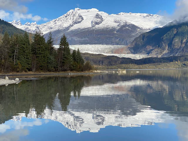 A tranquil reflection of Mendenhall glacier and surrounding newly snow-covered mountain peaks on Oct. 13. (Courtesy Photo / Denise Carroll)