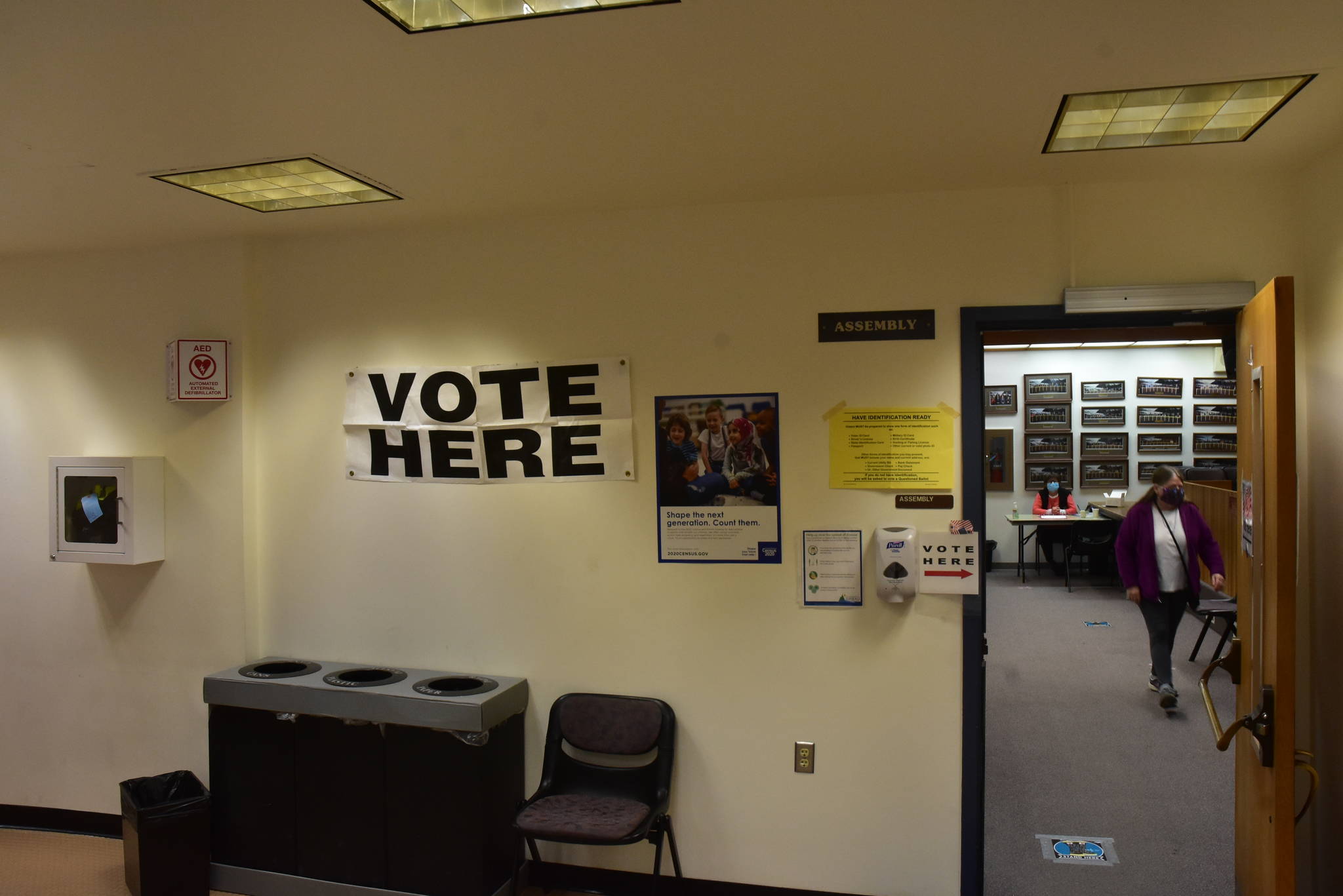 A sign marks the City and Borough of Juneau Assembly Chambers as a vote center on Tuesday, Oct. 6. The municipal election was a by-mail election, but registered voters had the option of dropping off ballots in person at vote centers and ballot drop boxes. (Peter Segall / Juneau Empire)