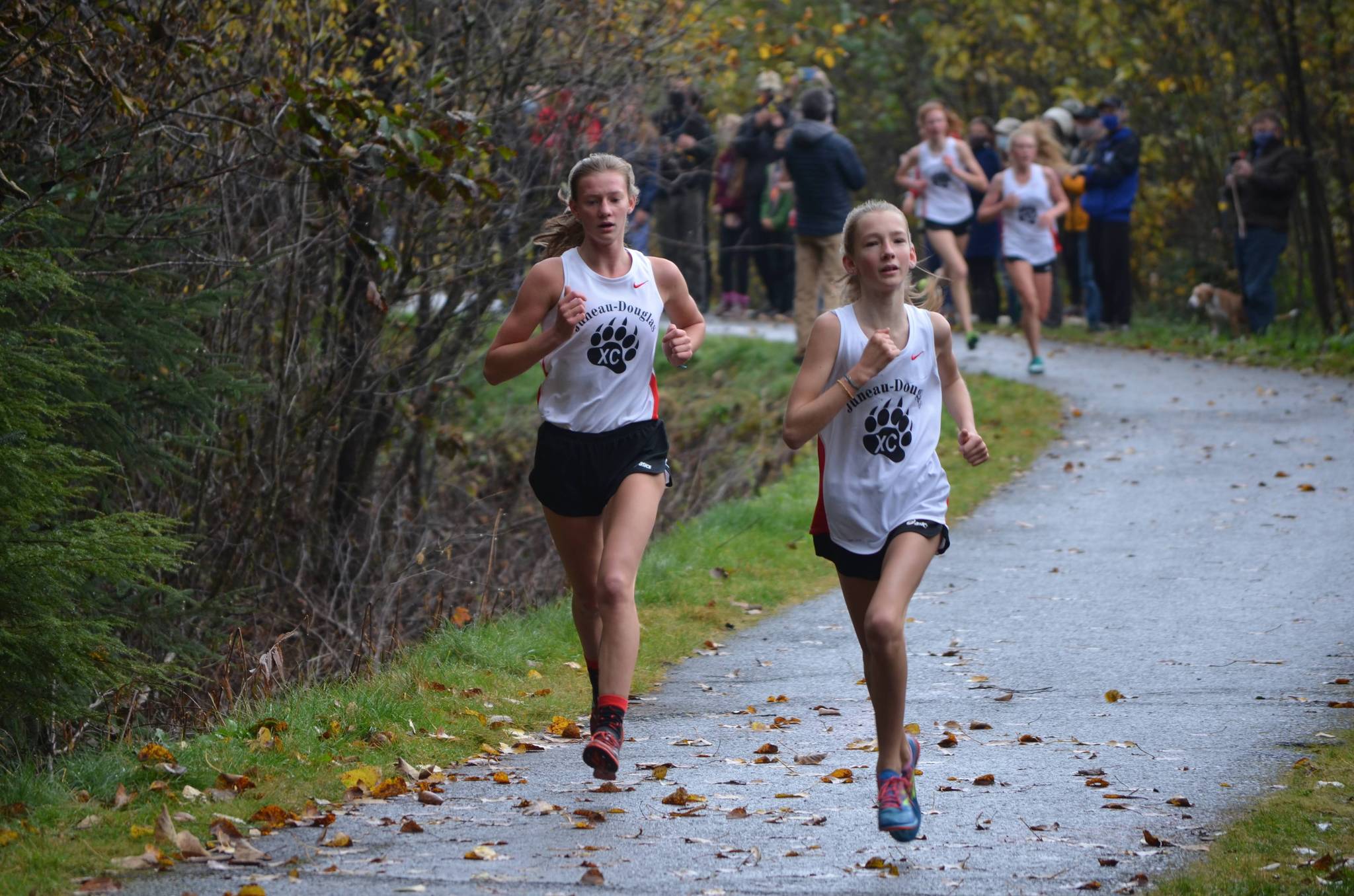 Juneau-Douglas Yadaa.at Kalé High School students Rayna Tuckwood (right) and Skylar Tuckwood (left) race at the Thunder Mountain High School cross country race course during a regionals meet, Oct. 3, 2020. (Courtesy photo / Debbie Lowenthal)