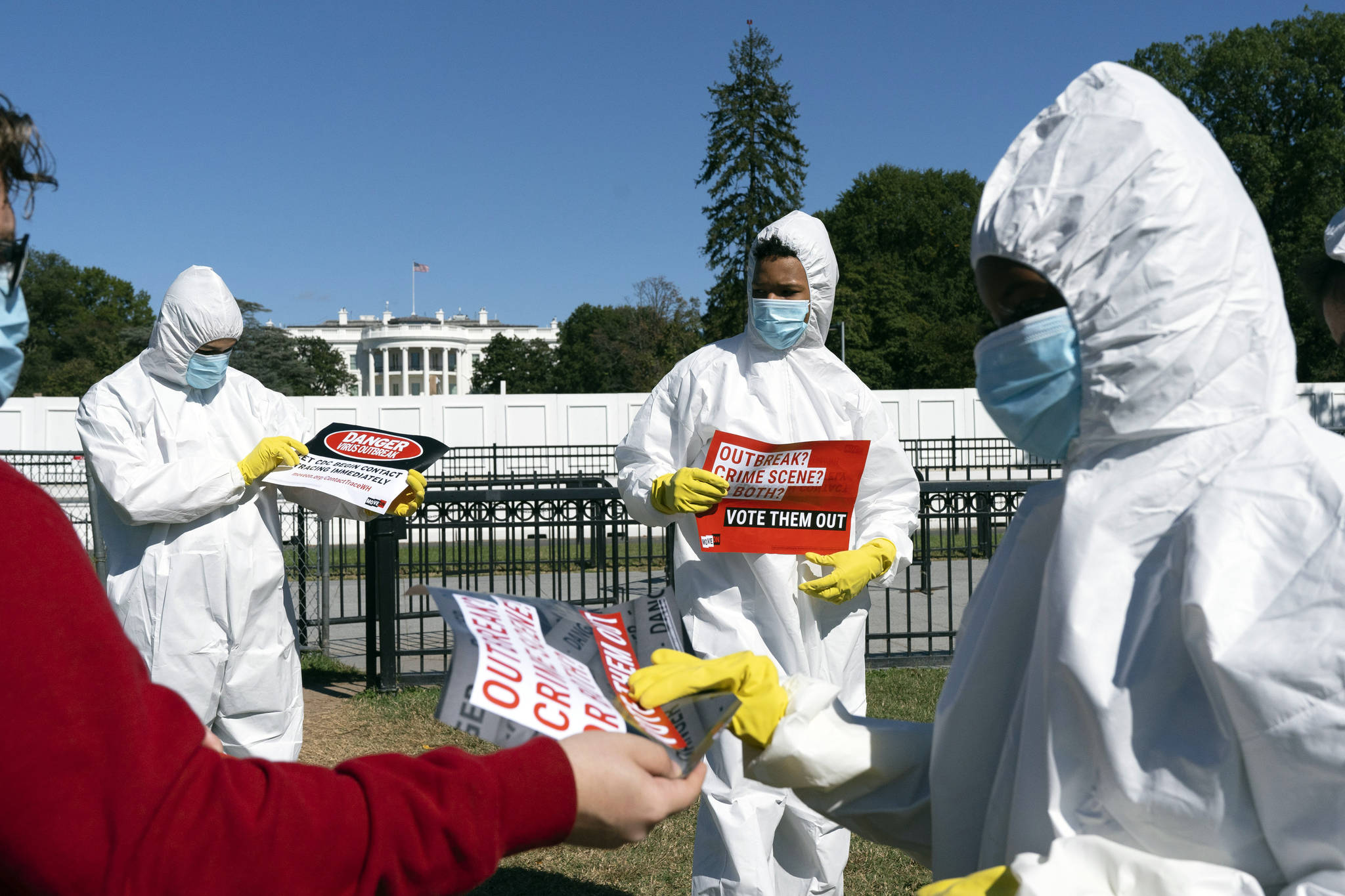 A group protests the ongoing outbreak of coronavirus in the White House, Thursday, Oct. 8, 2020, outside the White House in Washington. (AP Photo / Jacquelyn Martin)