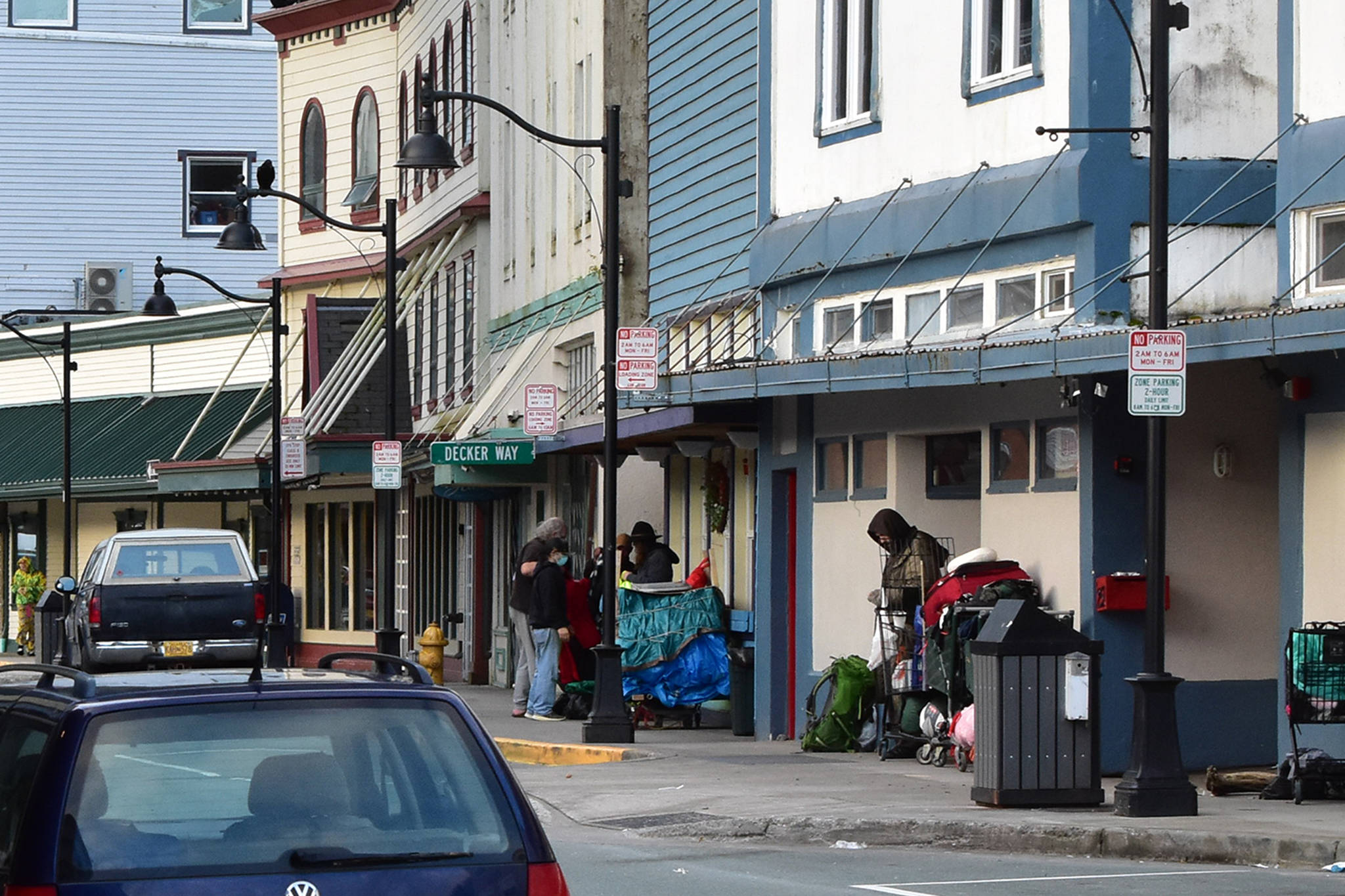 People mill outside the Glory Hall on South Franklin Street on Wednesday, Oct. 7. A local cluster of COVID-19 cases connected to Juneau’s housing-insecure population now numbers more than 30, according to City and Borough of Juneau. (Peter Segall / Juneau Empire)