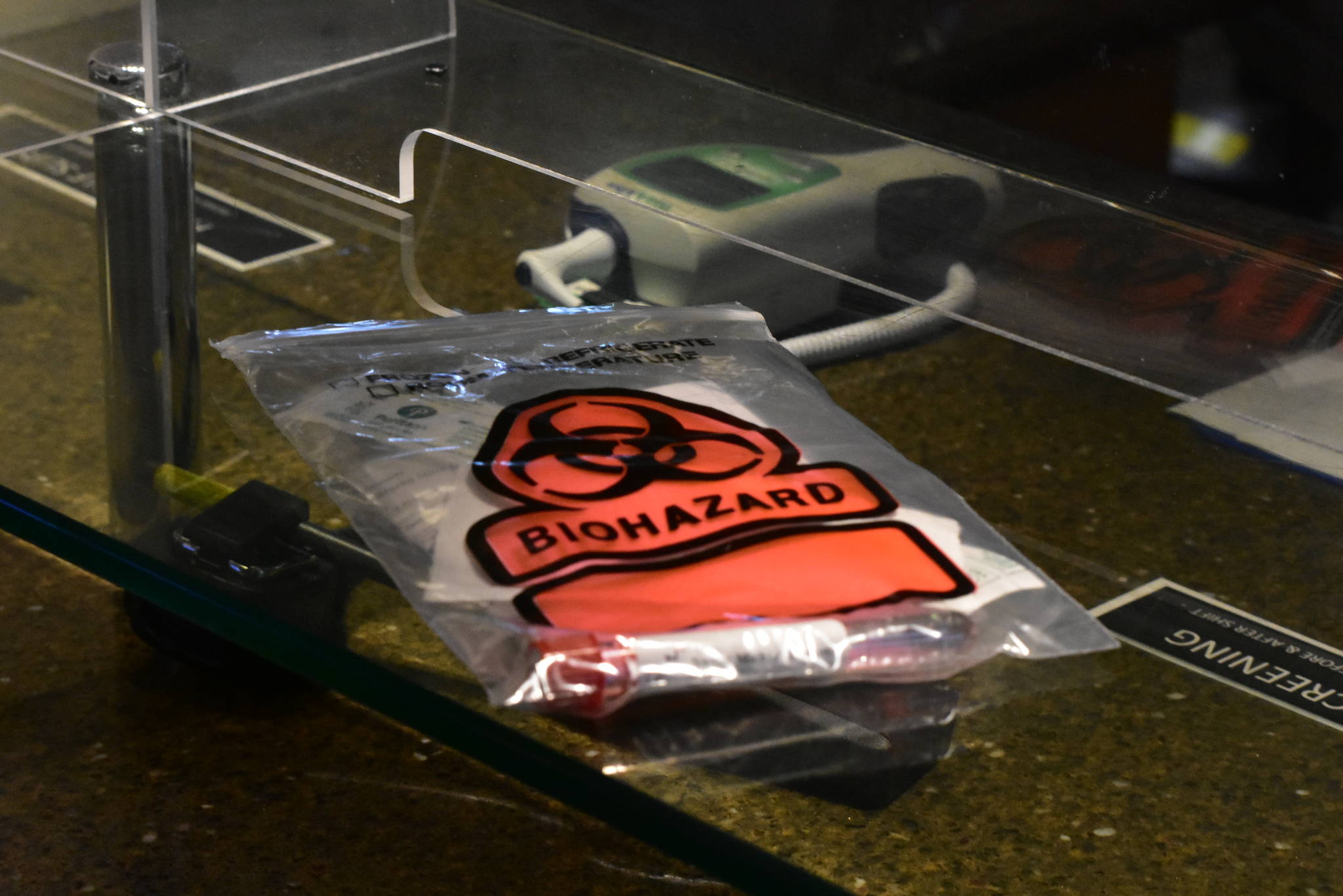 A COVID-19 test sits sealed on a counter in Juneau International Airport on Oct. 12. (Peter Segall / Juneau Empire)