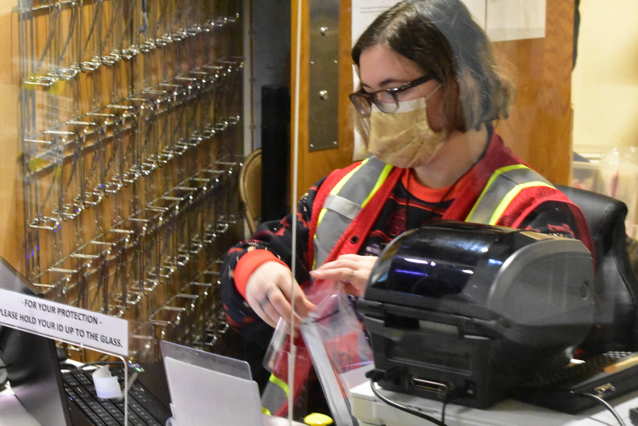 Emergency worker Amyrlin Thorne prepares a test kit for the screening station at Juneau International Airport on Monday, Oct. 12, 2020. (Peter Segall / Juneau Empire)