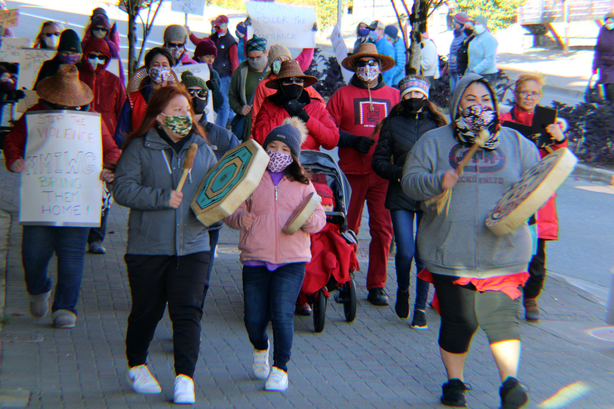 Marchers make their way toward Mayor Bill Overstreet Park on Saturday, Oct. 17. The march and rally were part of events held nationwide. (Ben Hohenstatt / Juneau Empire)