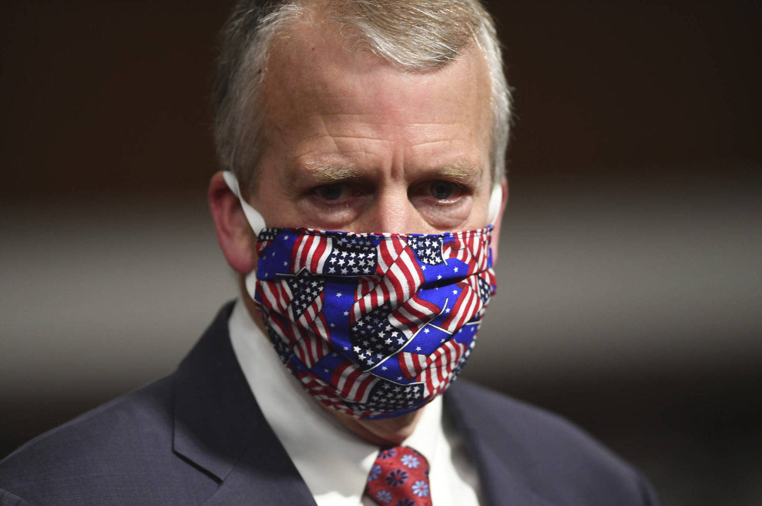 In this May 7, 2020 photo, Sen. Dan Sullivan wears a mask at a hearing in Washington. Sullivan's office released a statement Monday saying the senator would support a confirmation vote to fill the vacancy on the U.S. Supreme Court even in an election year. (Kevin Dietsch/Pool via AP)