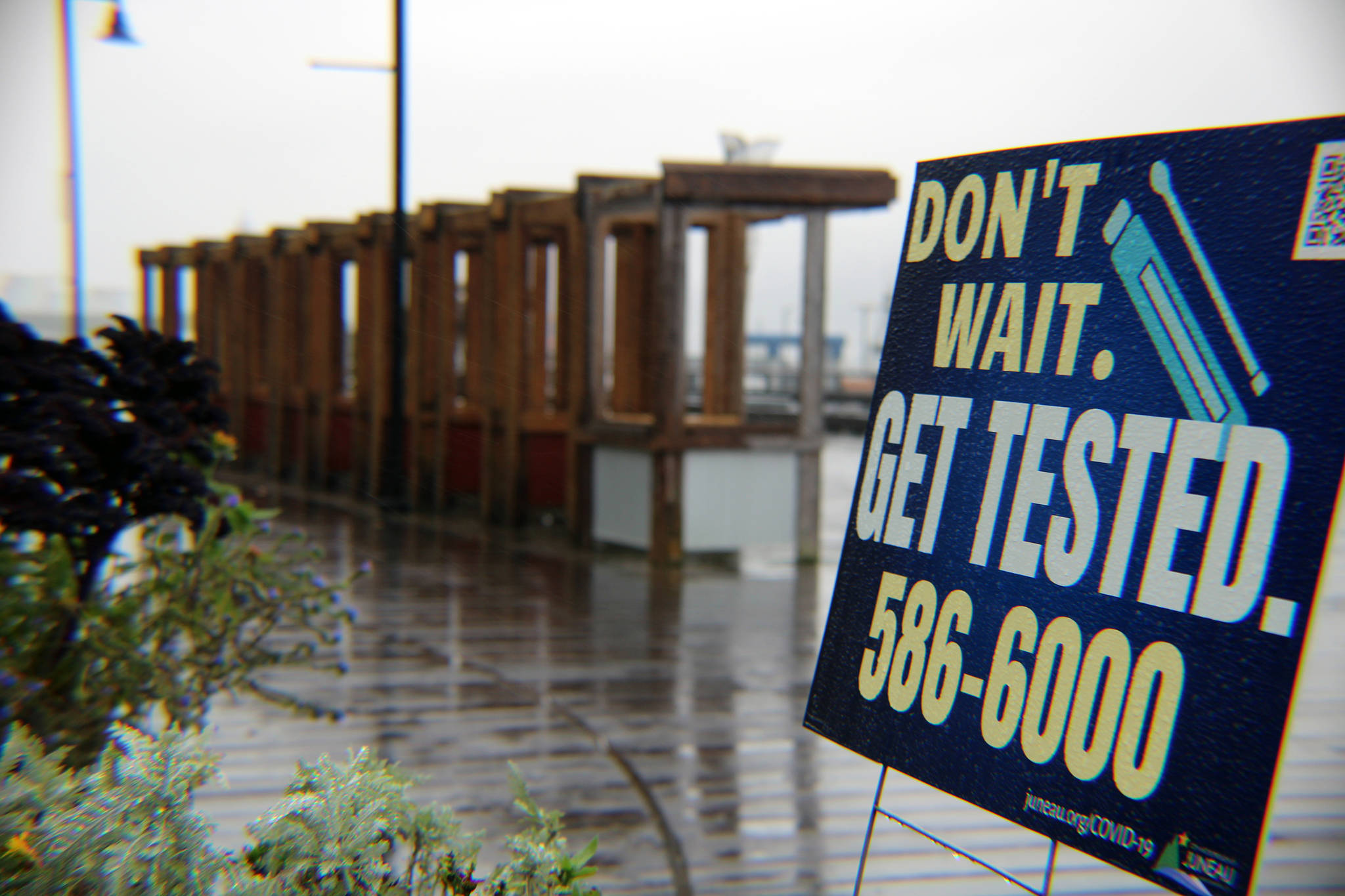 A sign in downtown Juneau encourages residents who have symptoms or otherwise believe they are at risk of having contracted the coronavirus to get tested. Local and statewide numbers have been on the rise in recent weeks. (Ben Hohenstatt / Juneau Empire File)