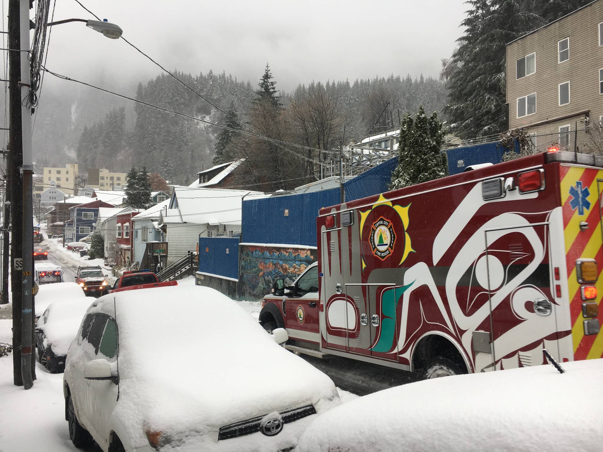 A Capital City Fire/Rescue truck clears the road ahead of an ambulance following a heavy winter storm on Nov. 2, 2020. (Michael S. Lockett / Juneau Empire)
