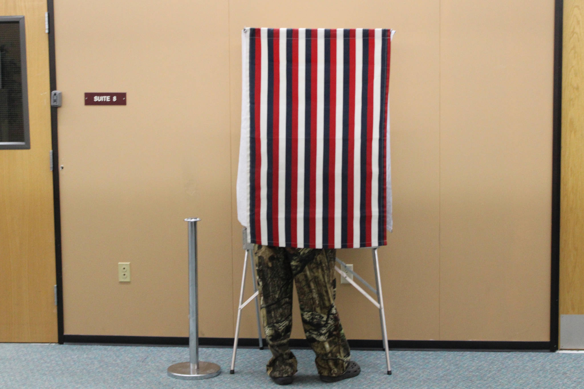 A man votes takes advantage of early voting at the Mendenhall Mall on Oct. 22, 2020. The FBI issued public guidance ahead of the general election warning voters about what is and isnt federal election crime, and how to report such crimes if theyre spotted. (Ben Hohenstatt / Juneau Empire)