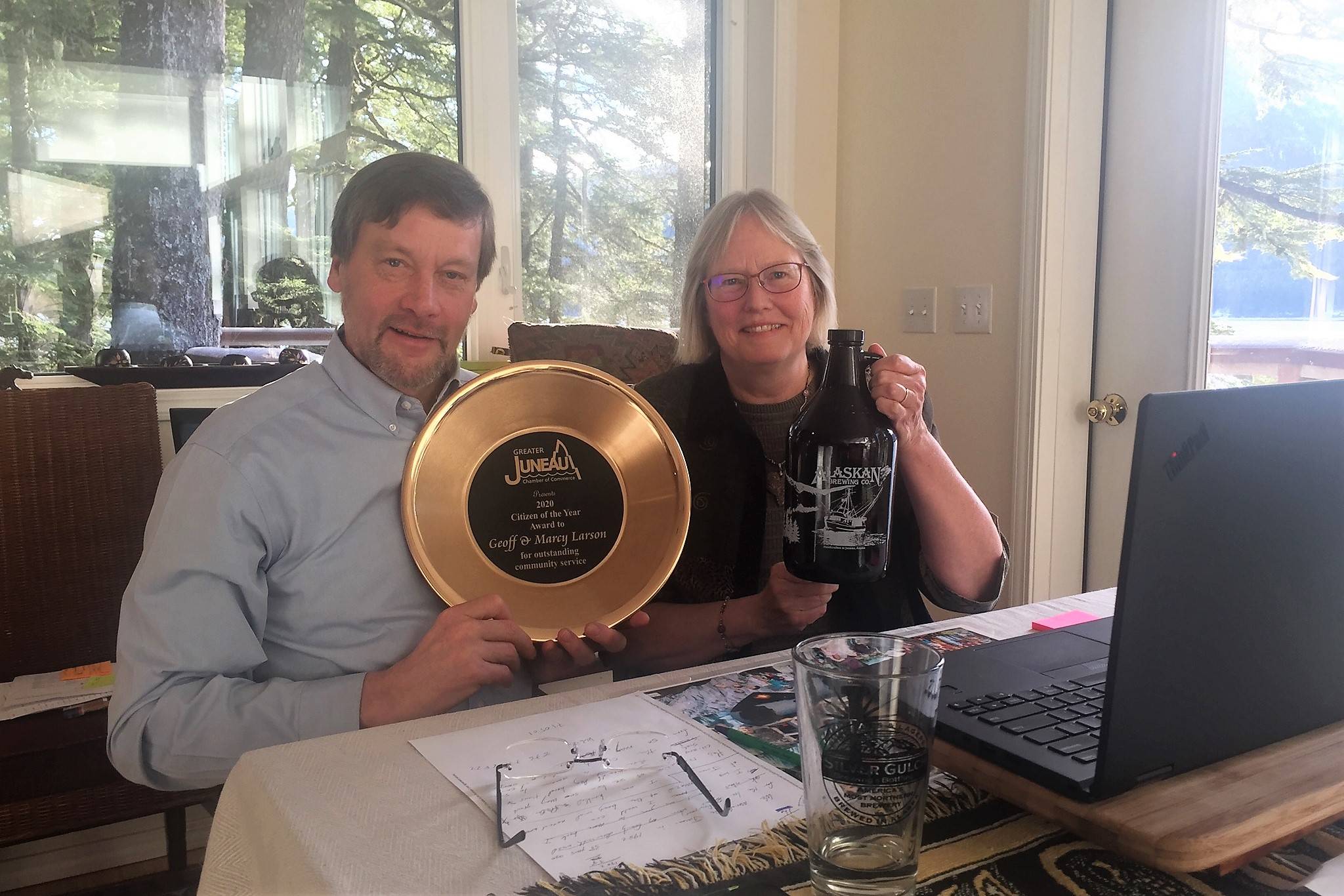 Geoff and Mary Larson hold up their Citizen of the Year Award from the Greater Juneau Chamber of Commerce. (Courtesy photo / Alaskan Brewing Company)