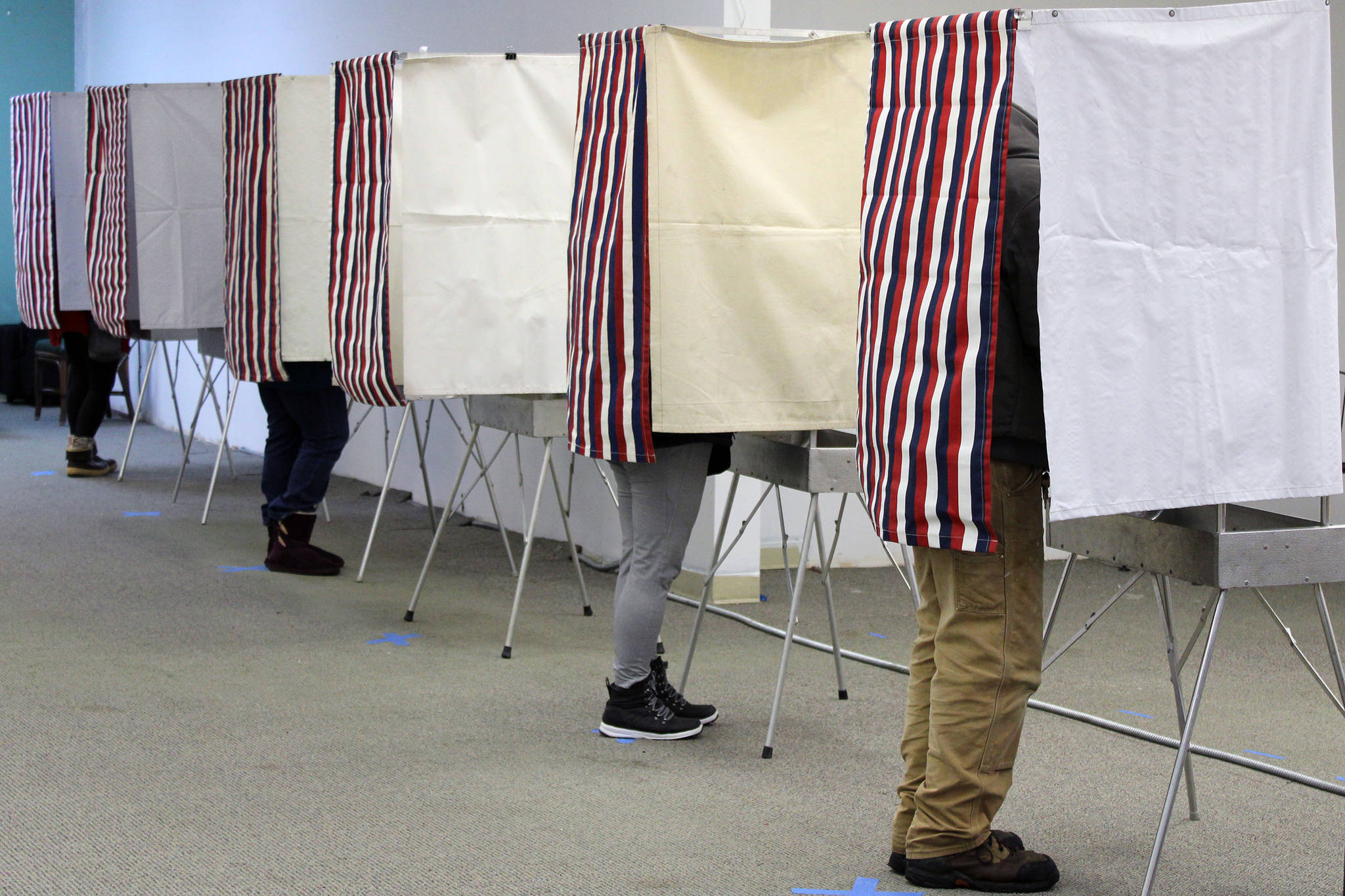 Nearly every voting booth is occupied at a polling place in Nugget Mall on Nov. 3, 2020. (Ben Hohenstatt / Juneau Empire)