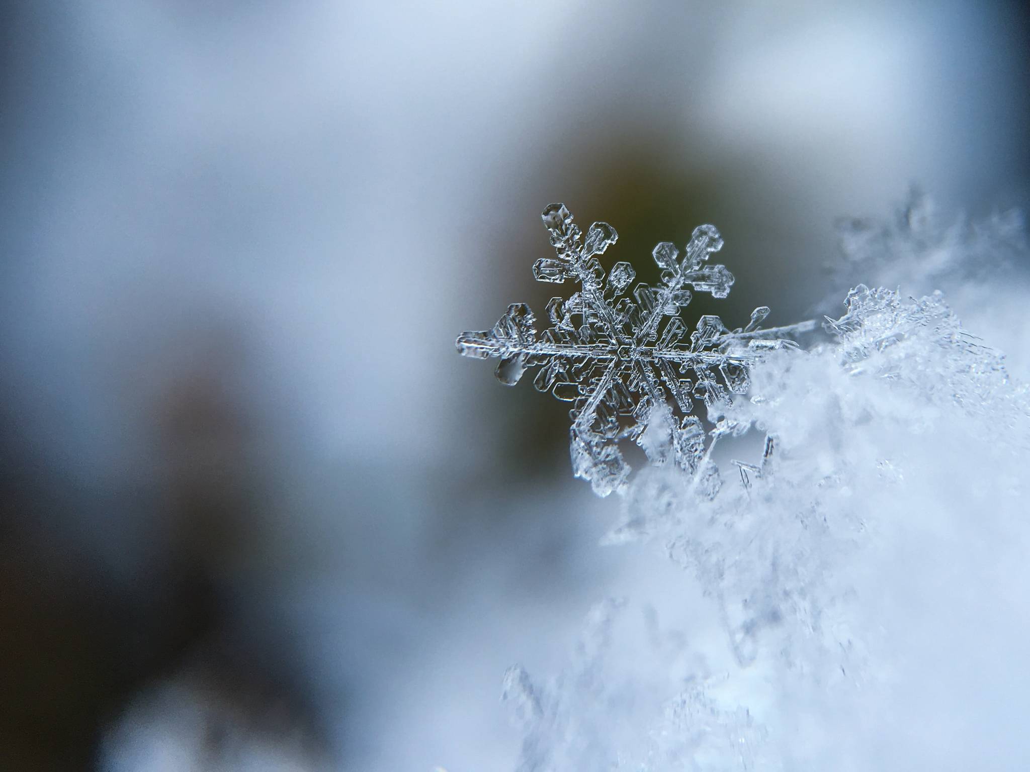 Snow is a form of precipitation in the form of crystallized ice that predominately falls in winter; in Alaska, this can mean every month aside from July, and even then… (Unsplash / Aaron Burden)