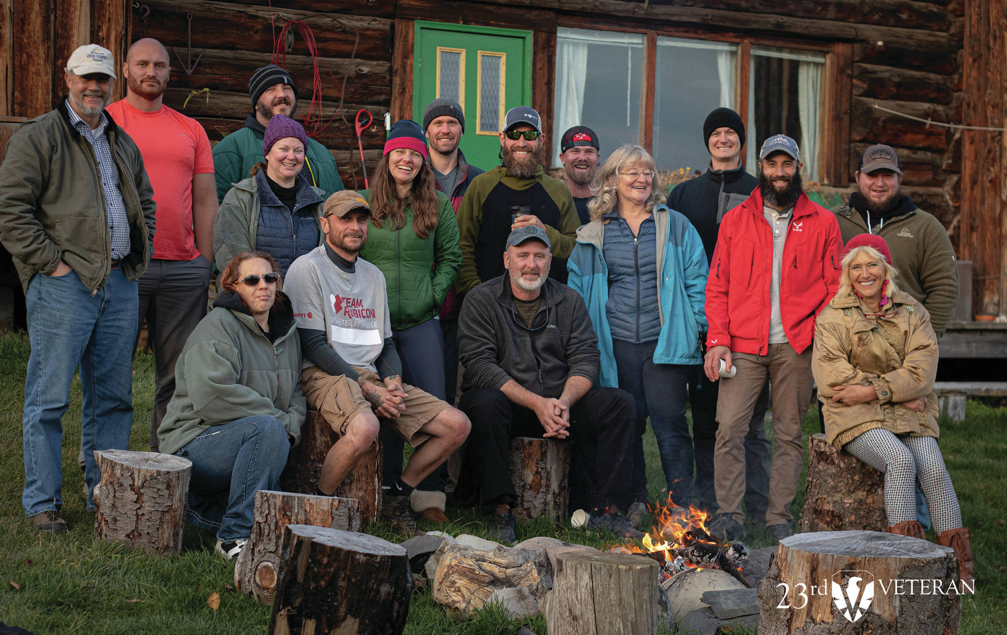A group of veterans who participated in the 23rd Veteran trip to Homer, Alaska, pose at the Kilcher Family Homestead near Homer, Alaska, on the last day of the trip on Friday, Oct. 16, 2020. At far right, front, is Stellavera Kilcher, and third from right is Catkin Kilcher Burton, two of the Kilcher family members who participated in the visit. (Photo courtesy of 23rd Veteran)