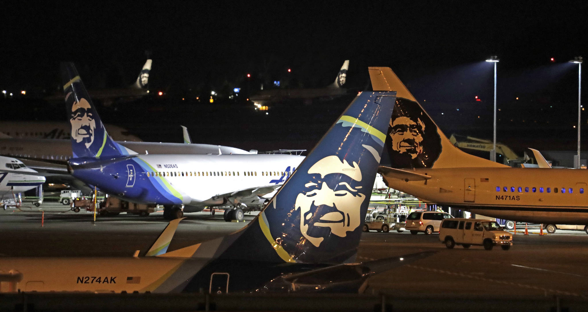 In this August 2018 photo, Alaska Airlines planes sit on the tarmac at Sea-Tac International Airport in SeaTac, Wash. Officials say an Alaska Airlines jetliner struck a brown bear while landing early Saturday evening, Nov. 14, 2020, killing the animal and causing damage to the plane. (AP Photo / Elaine Thompson)