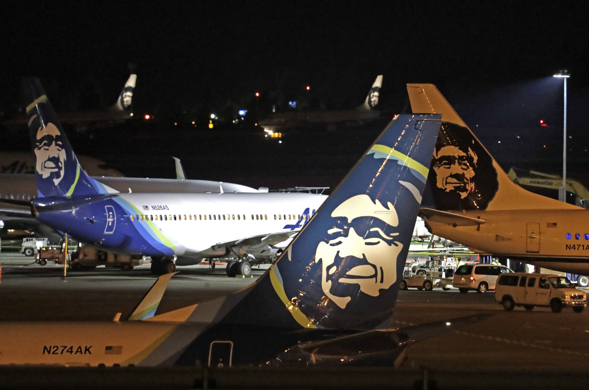 In this August 2018 photo, Alaska Airlines planes sit on the tarmac at Sea-Tac International Airport in SeaTac, Wash. Officials say an Alaska Airlines jetliner struck a brown bear while landing early Saturday evening, Nov. 14, 2020, killing the animal and causing damage to the plane. (AP Photo / Elaine Thompson)