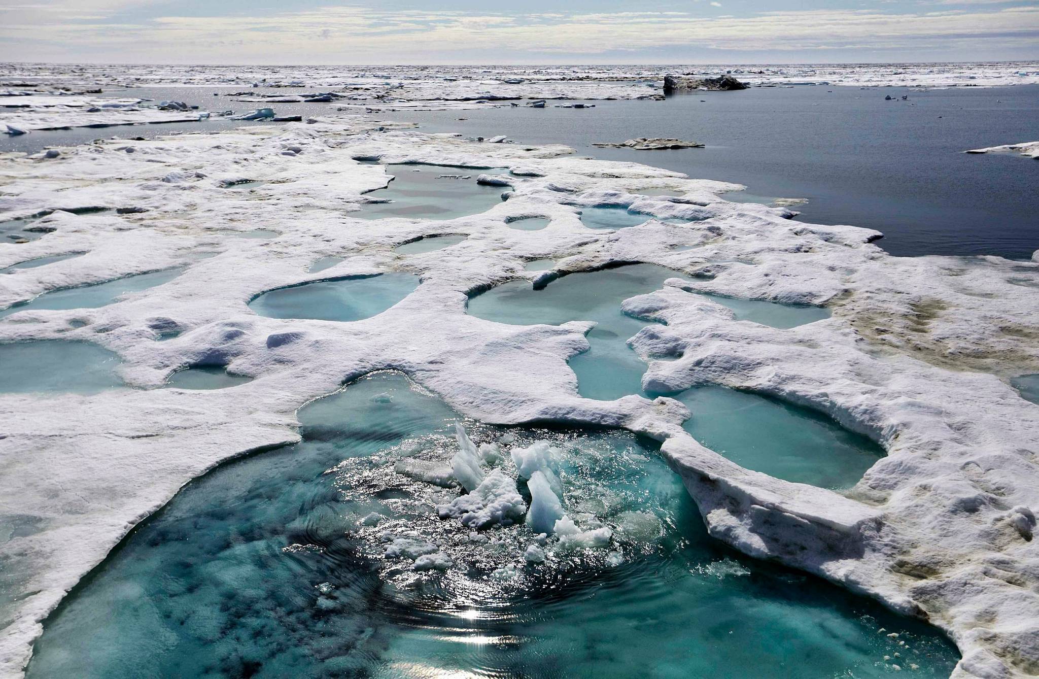 Ice is broken up by the passing of the Finnish icebreaker MSV Nordica as it sails through the Beaufort Sea off the coast of Alaska. Down to its final weeks, the Trump administration is working to push through dozens of environmental rollbacks that could weaken century-old protections for migratory birds, expand Arctic drilling and hamstring future regulation of public health threats. (AP Photo / David Goldman)