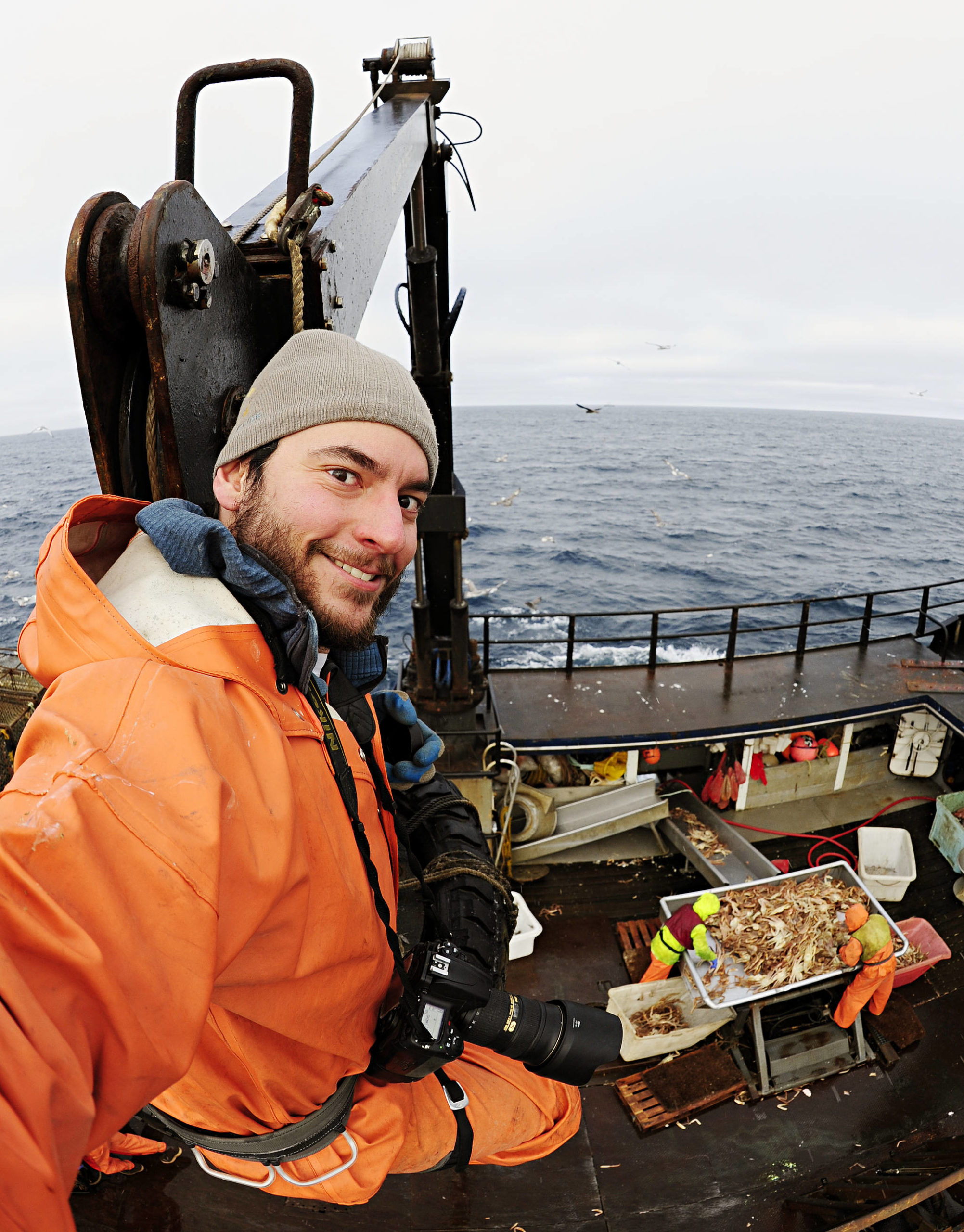 Chris Miller photographing the Bering Sea crab fishery. (Courtesy Photo / Chris Miller)