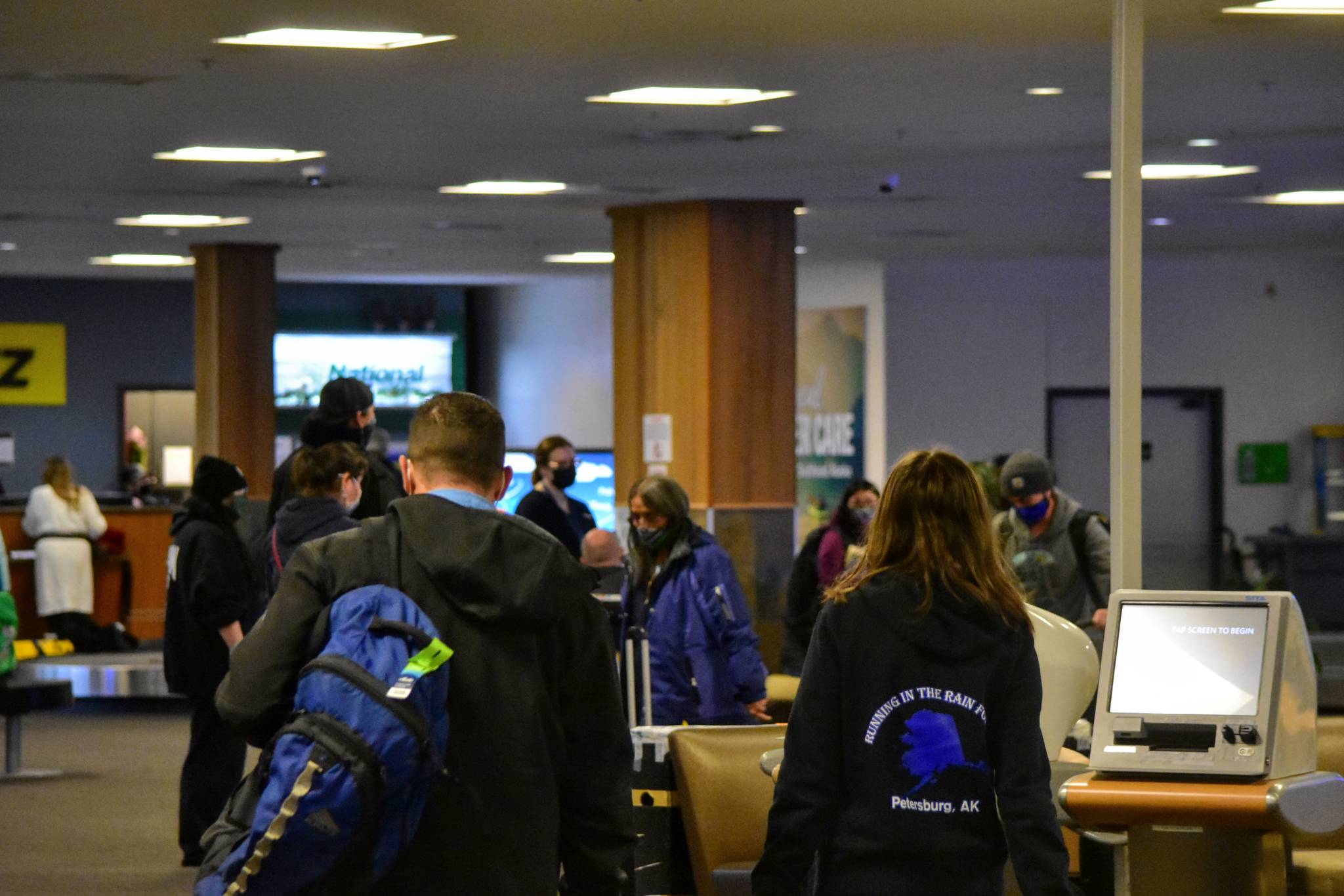 Travelers arrive at the Juneau International Airport on Wednesday, Nov. 25, 2020, made up only about half of what the airport normally sees in the days leading up to the Thanksgiving holiday. (Peter Segall / Juneau Empire)