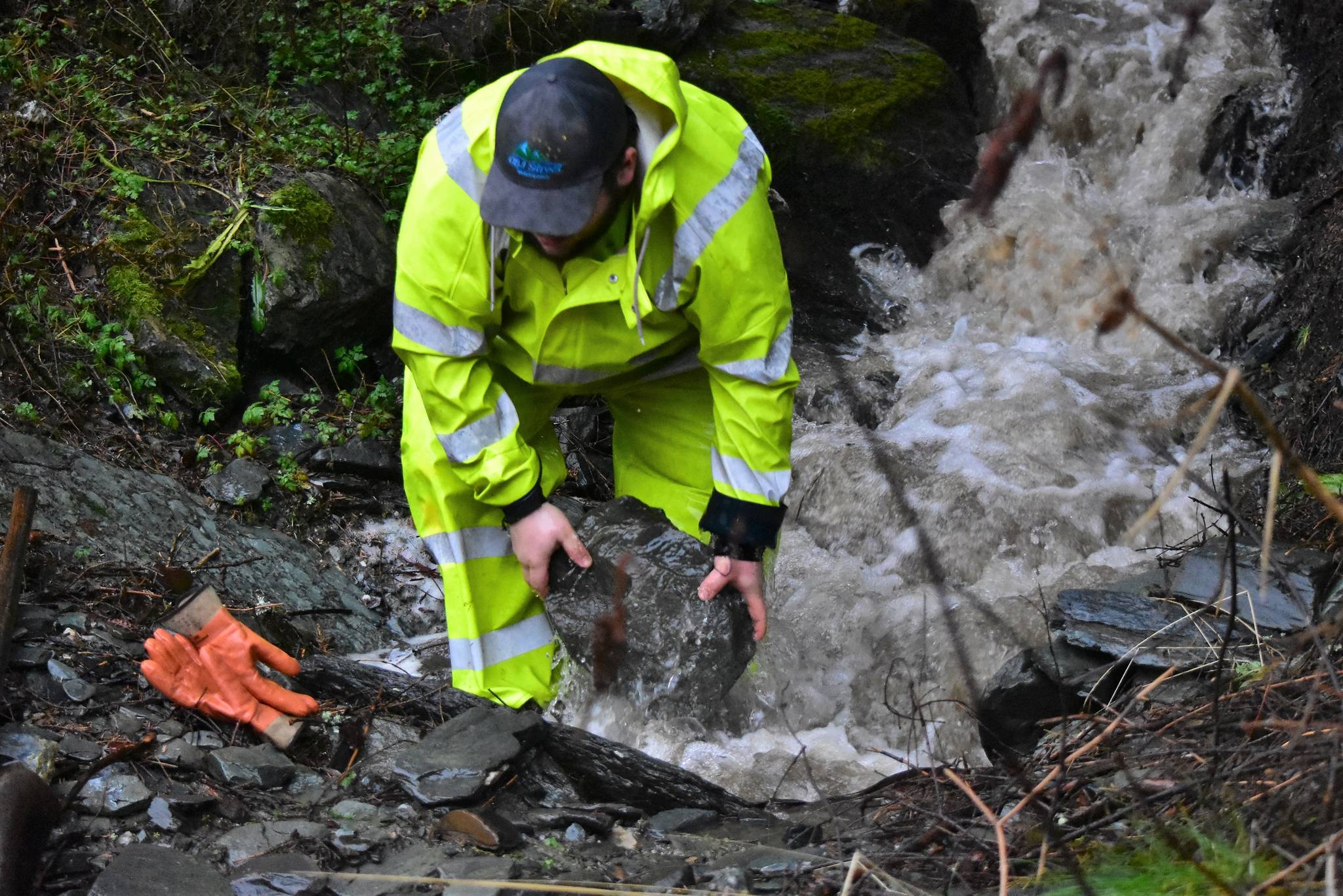 Tucker Reece, a laborer with the City and Borough Department of Parks and Recreation heads to clear a blockage near Cope Park caused by heavy rains on Tuesday, Dec. 1, 2020. (Peter Segall / Juneau Empire)