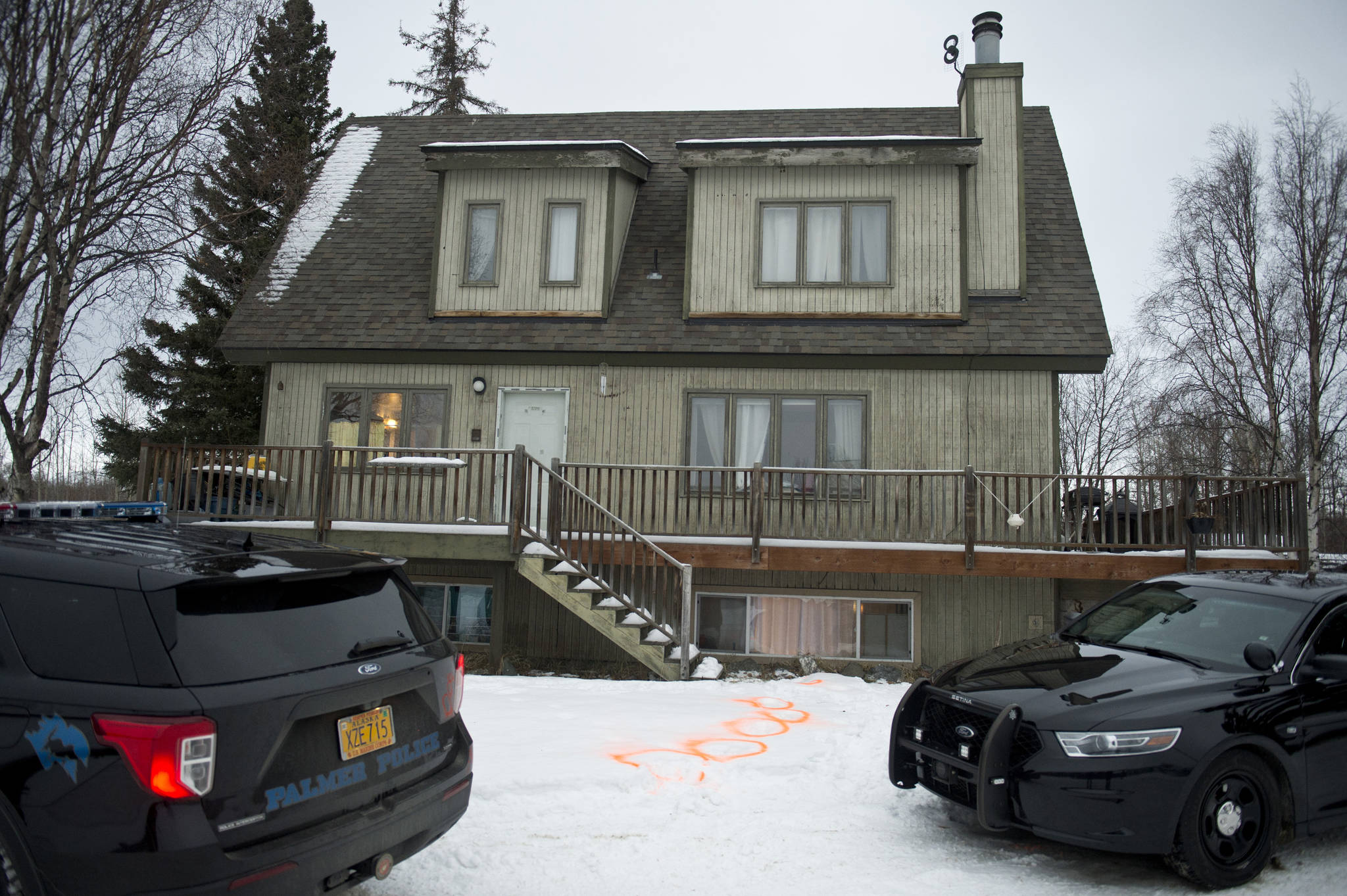 Alaska State Troopers investigate a fatal shooting scene at a home on North Valley Way in Palmer, Alaska, Monday, Nov. 30, 2020. An 18-year-old Alaska man just out of jail for assaulting a family member has been charged with killing four members of his family, including two cousins under the age of 10, charging documents released Tuesday, Dec. 1, 2020 said. (Marc Lester / Anchorage Daily News)
