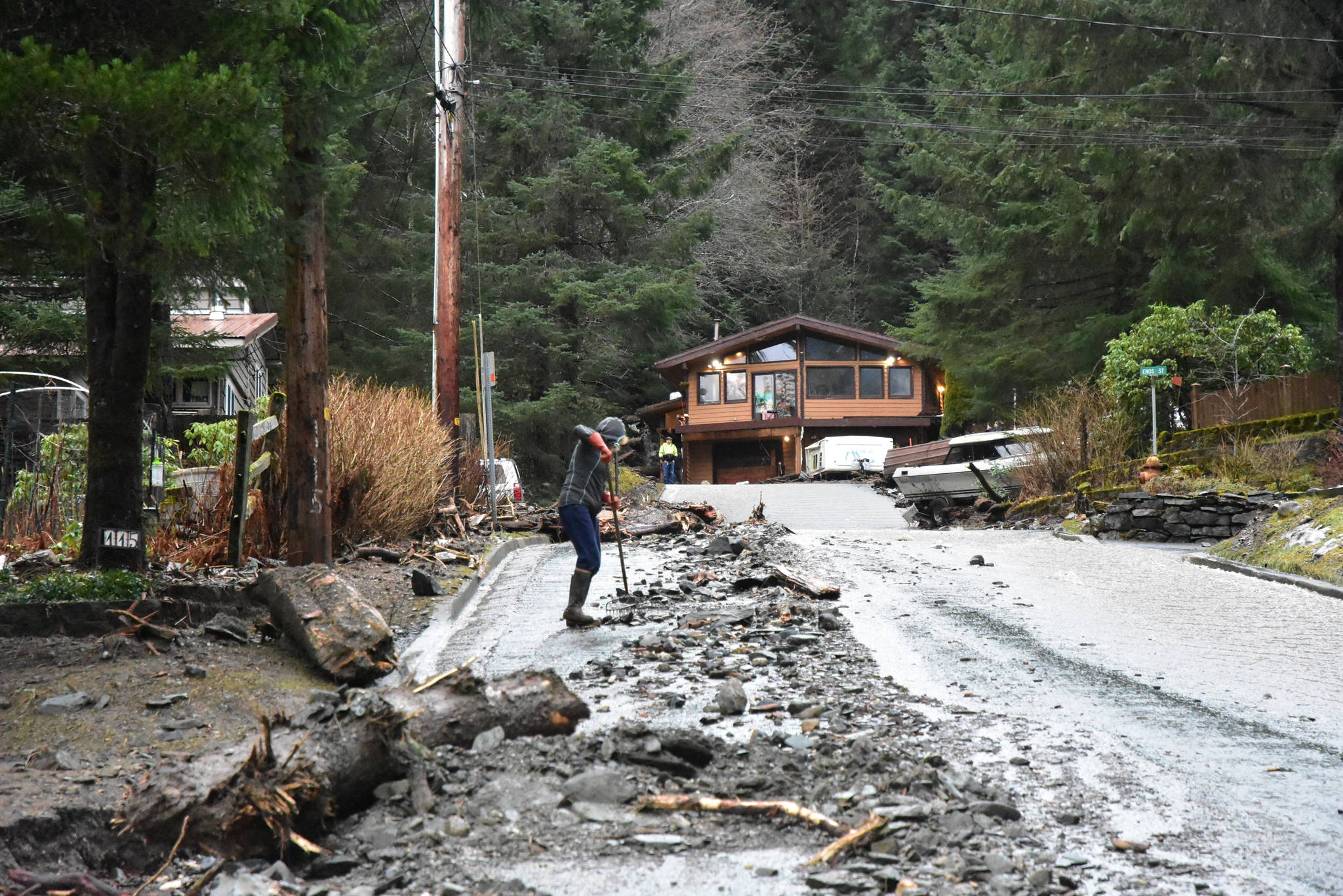 A mudslide at the top of Wire Street near Twin Lakes washed rocks, mud and a boat down the road, forcing the closure of the street. (Peter Segall / Juneau Empire)