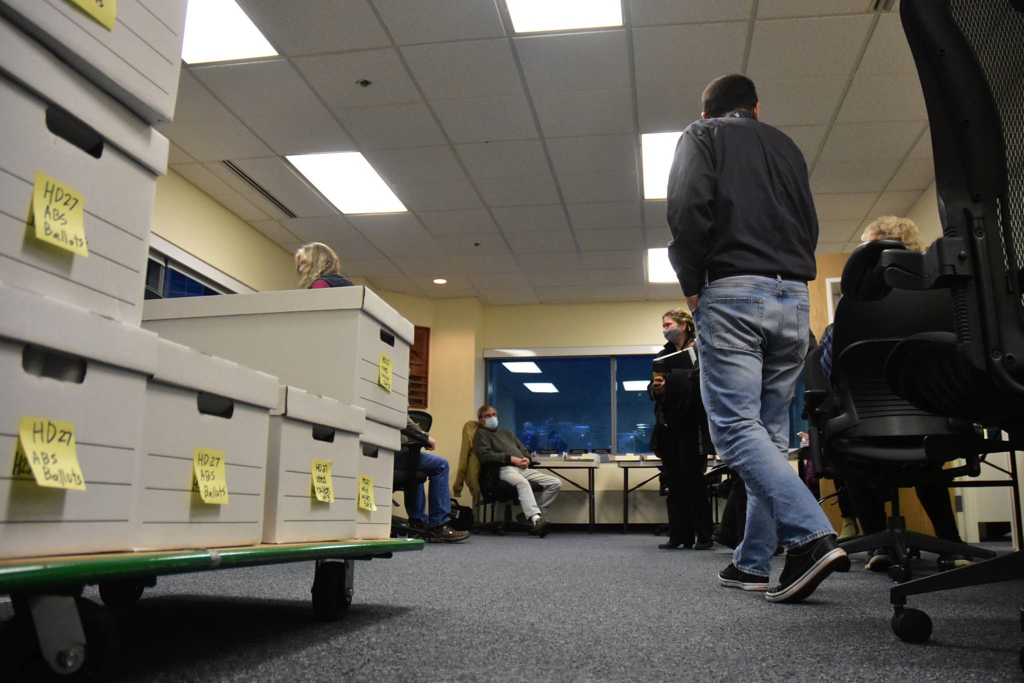 Divisions of Elections staff and members of the State Review Board get ready to recount ballots from Anchorage’s House District 27 at the DOE director’s office in Juneau on Friday, Dec. 4, 2020. (Peter Segall / Juneau Empire)